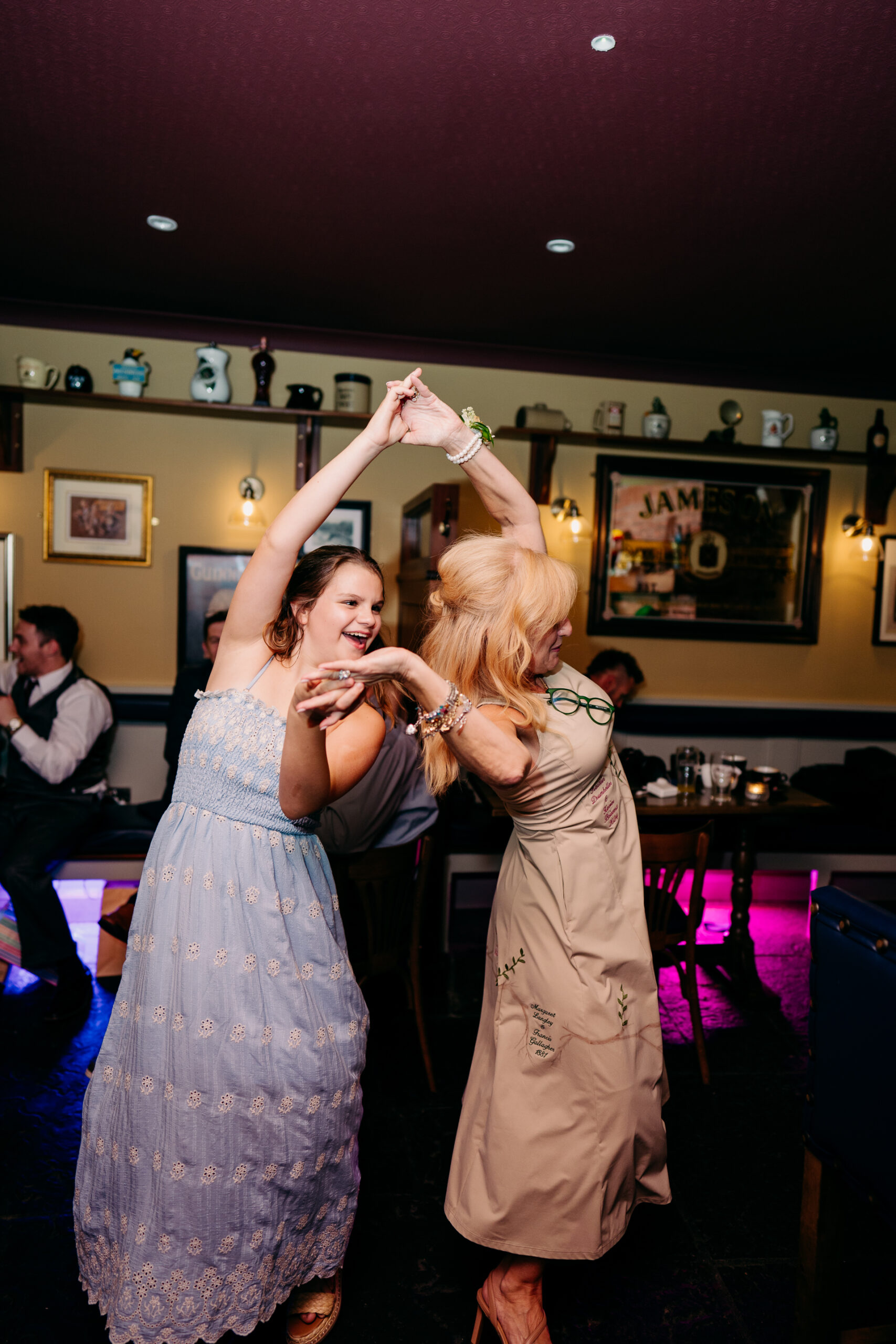 A couple of women dancing