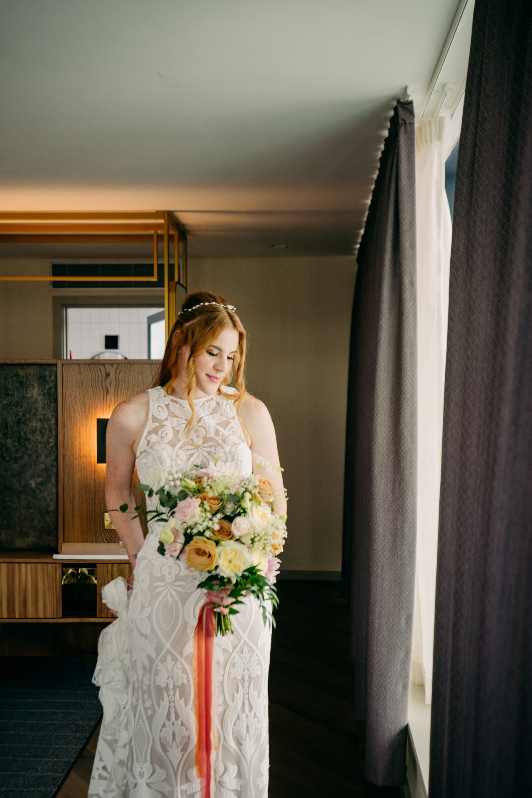 A person in a white dress holding a bouquet of flowers