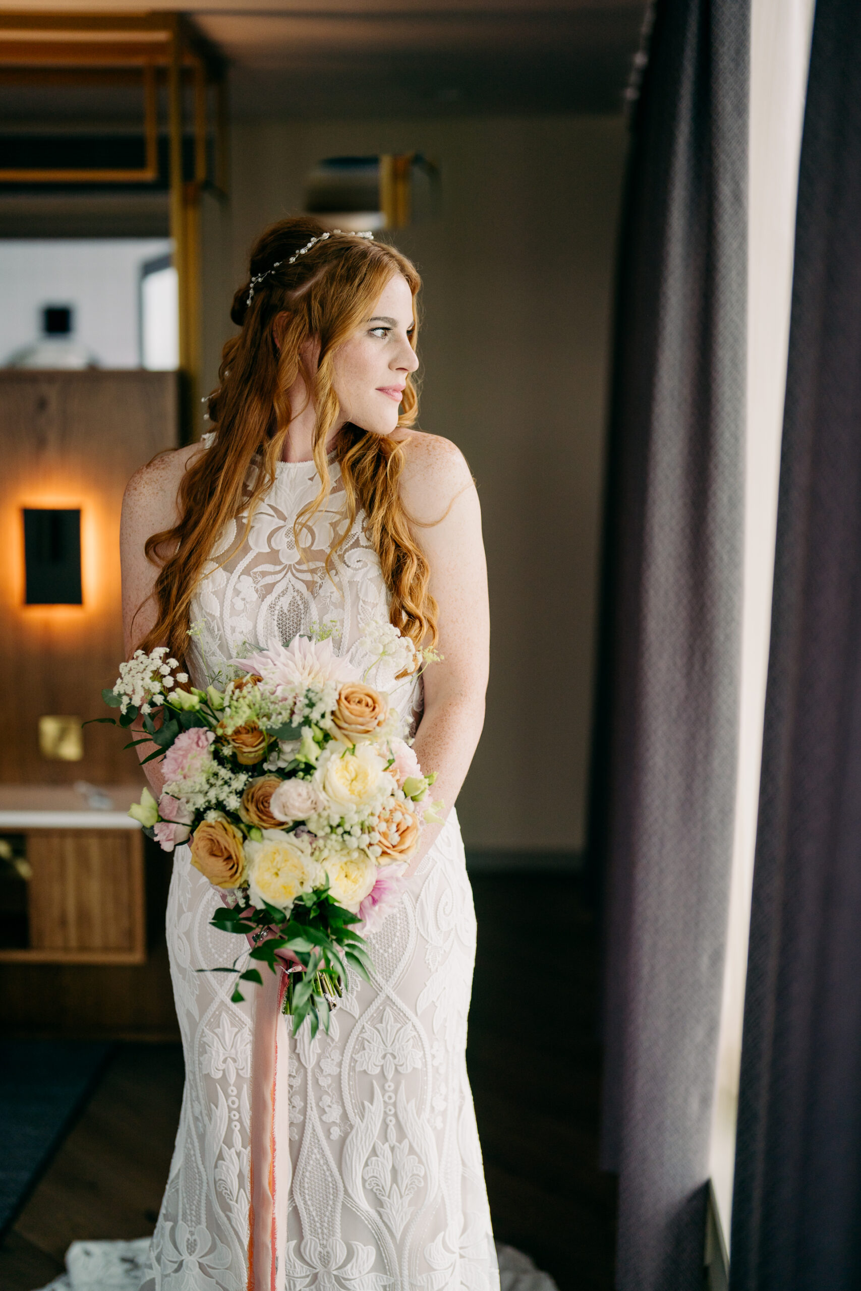 A woman in a white dress holding a bouquet of flowers