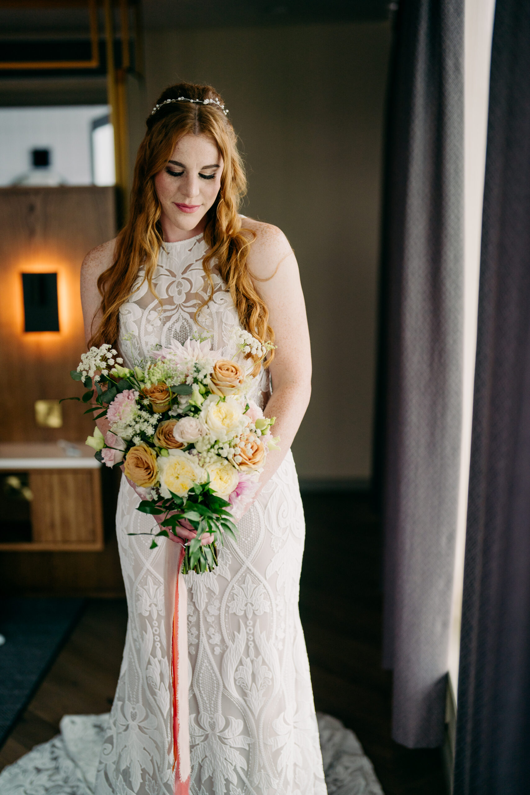 A woman in a white dress holding a bouquet of flowers