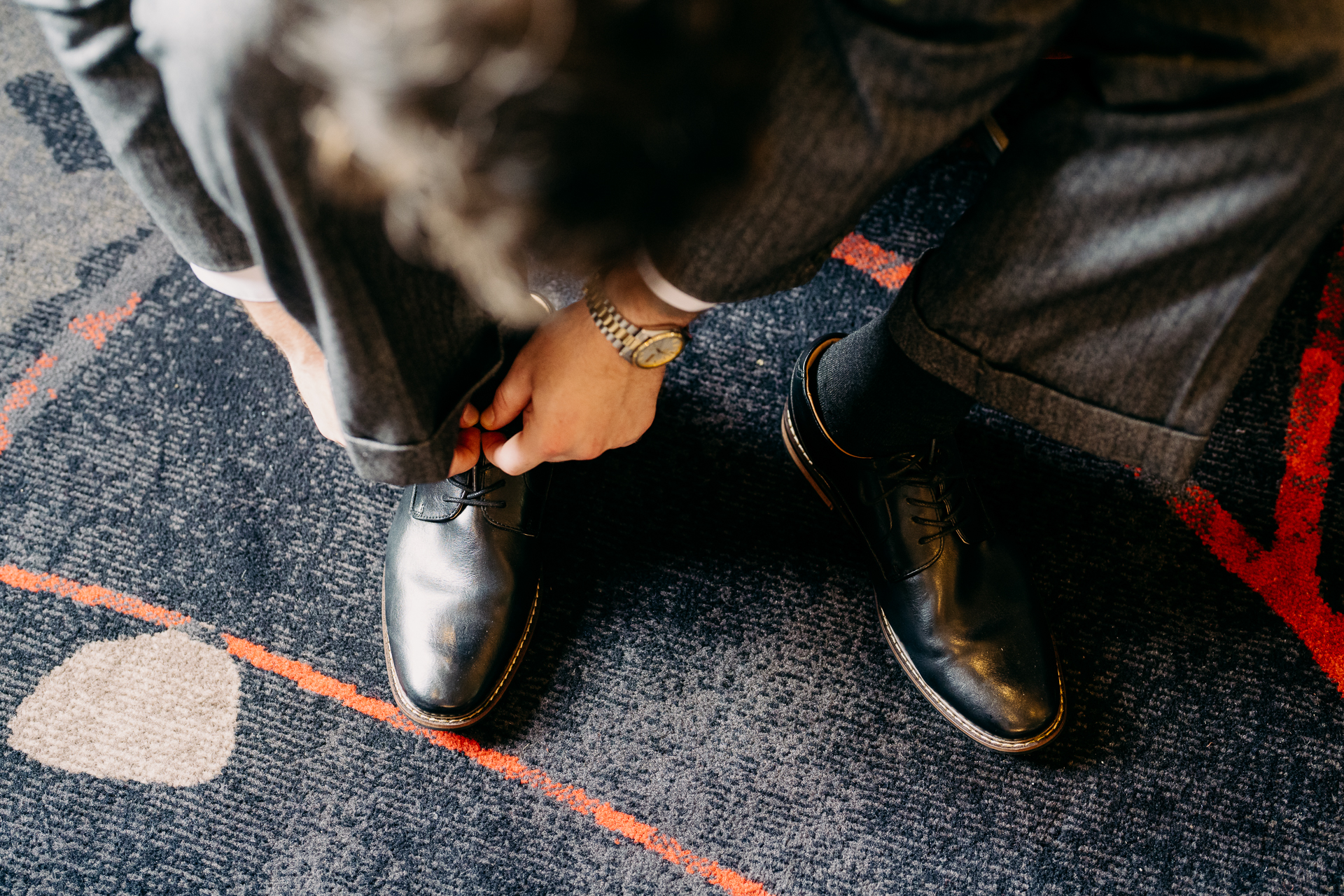 A person tying a shoe