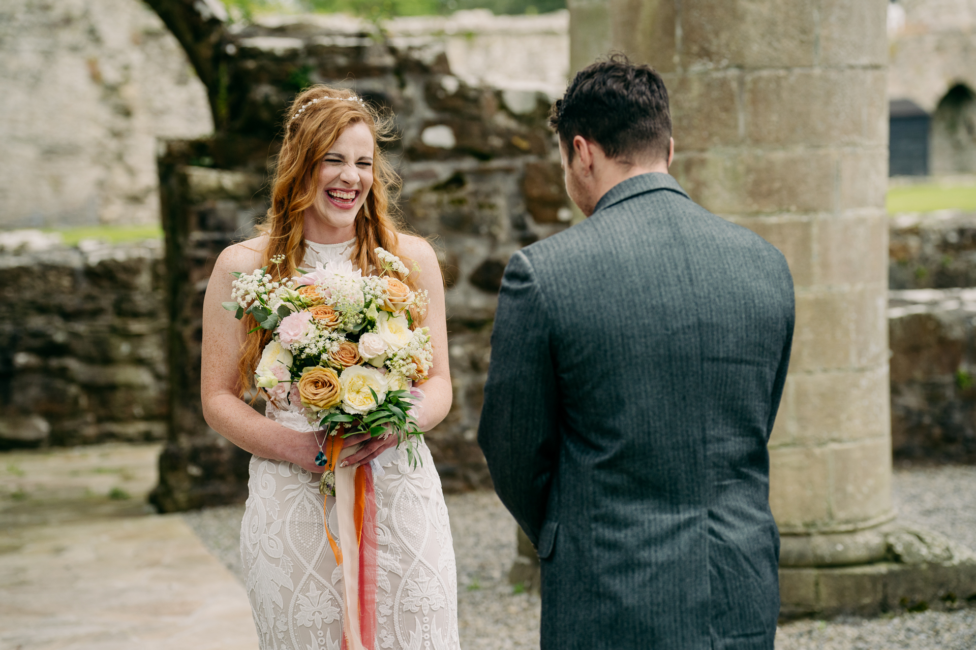 A man and woman holding flowers