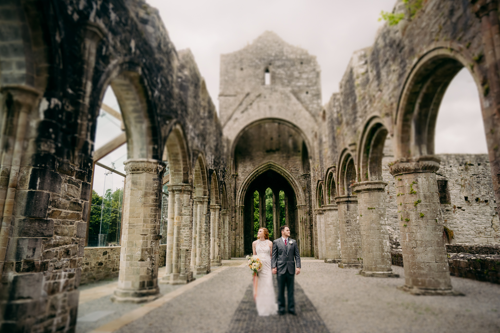 A couple walking in an old building