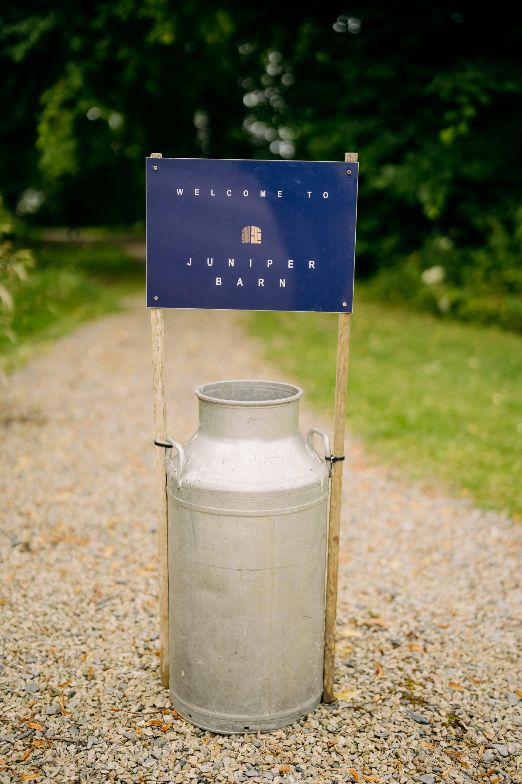 A blue sign on a metal cylinder