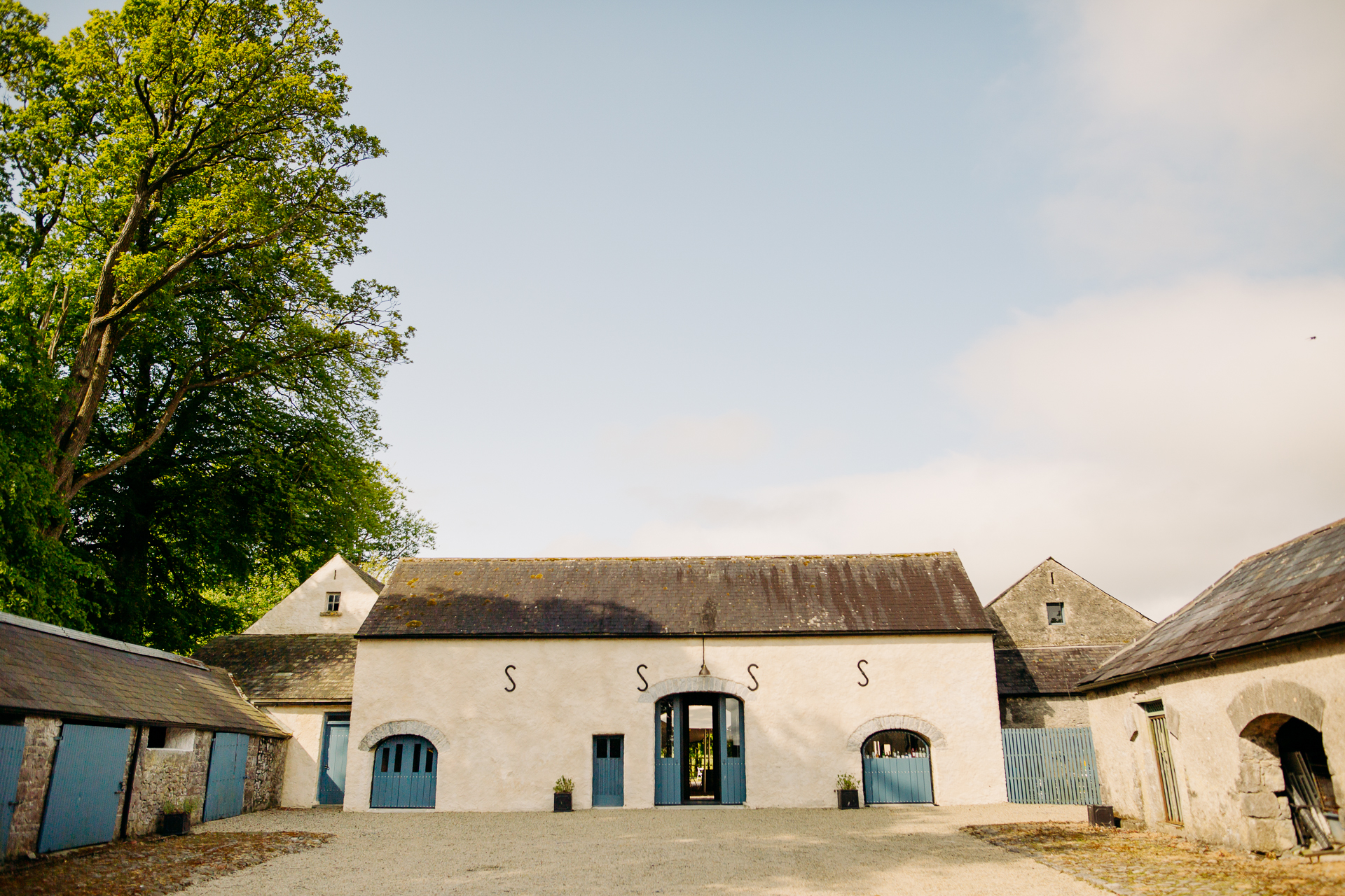 A group of buildings with blue doors