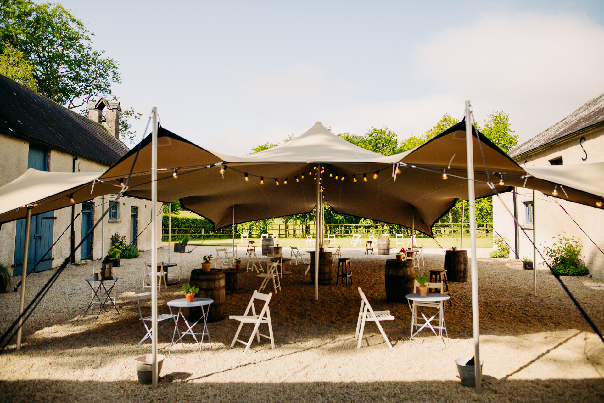 A tent with a table and chairs