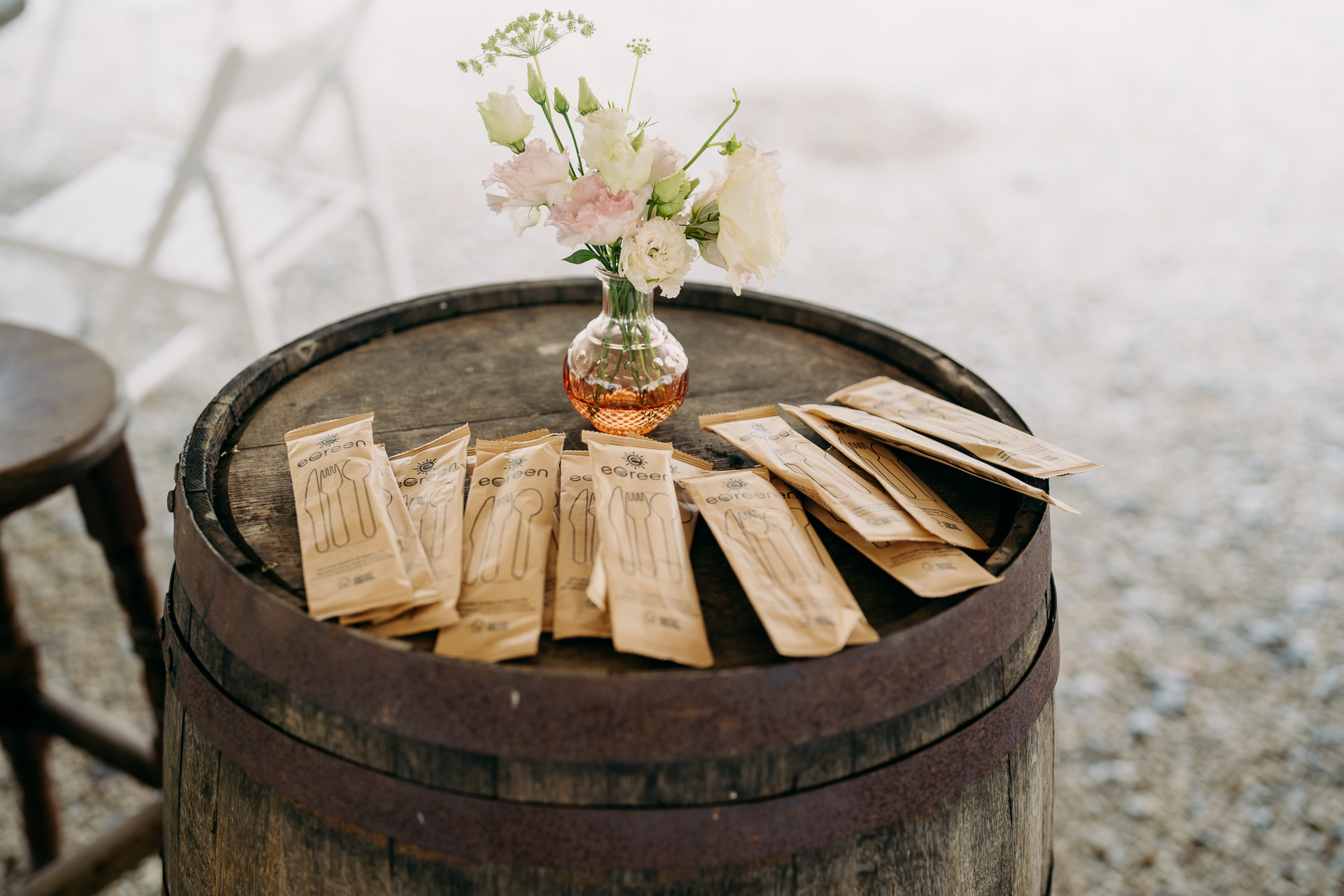 A vase of flowers on a barrel