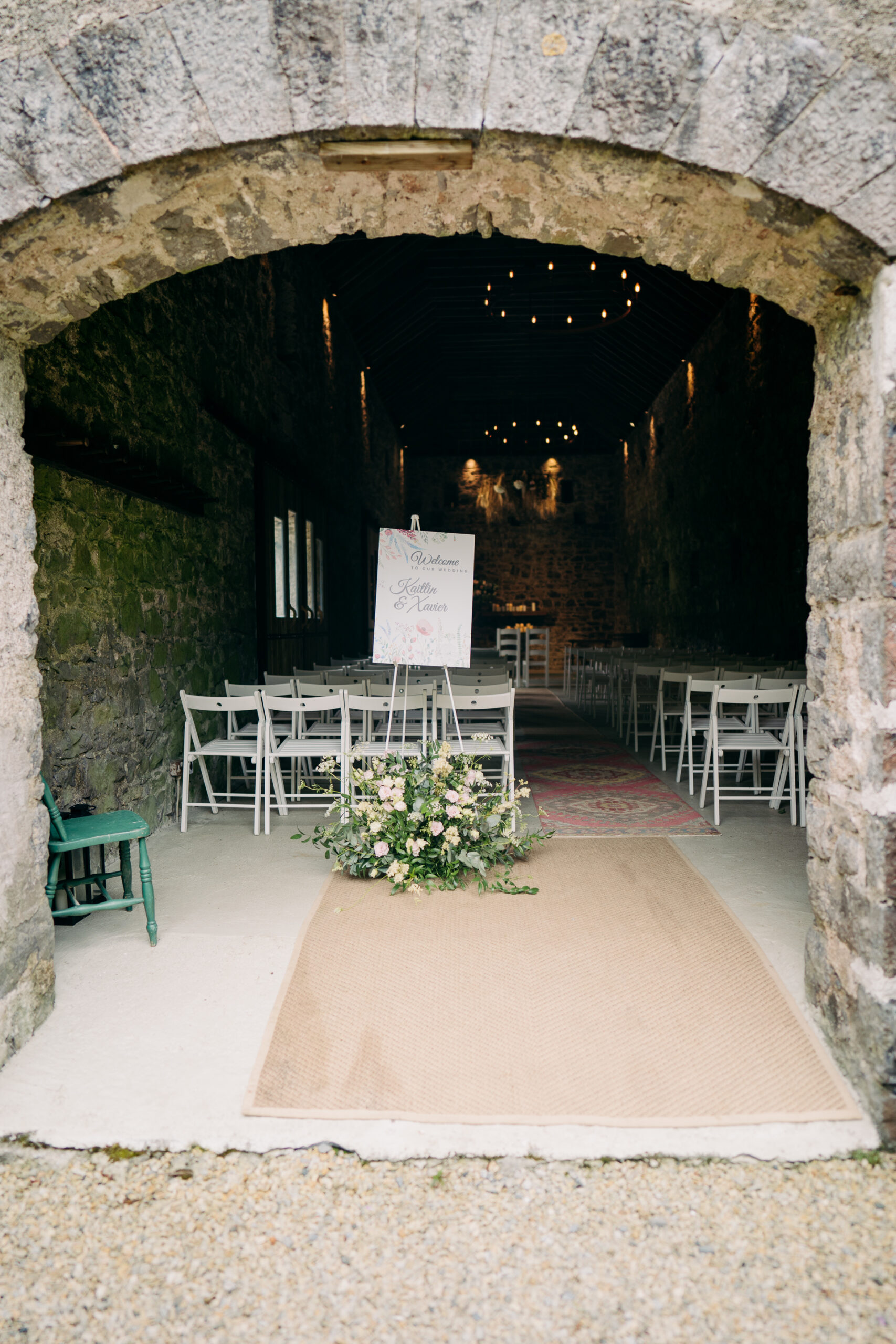 A table and chairs in a stone building