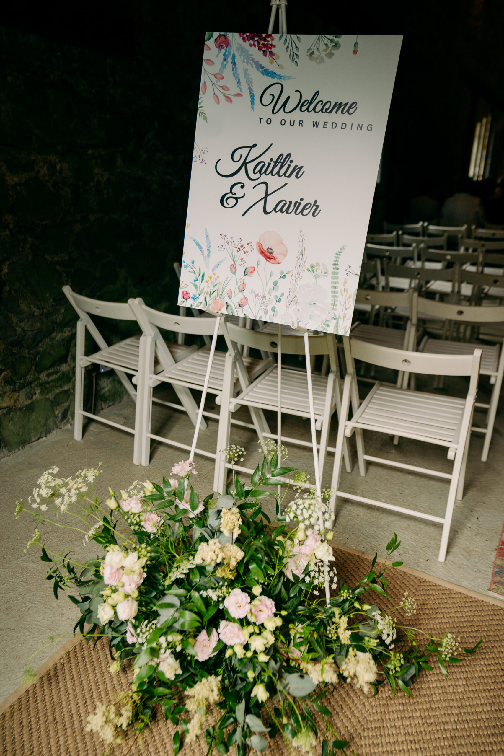 A sign in front of a group of chairs