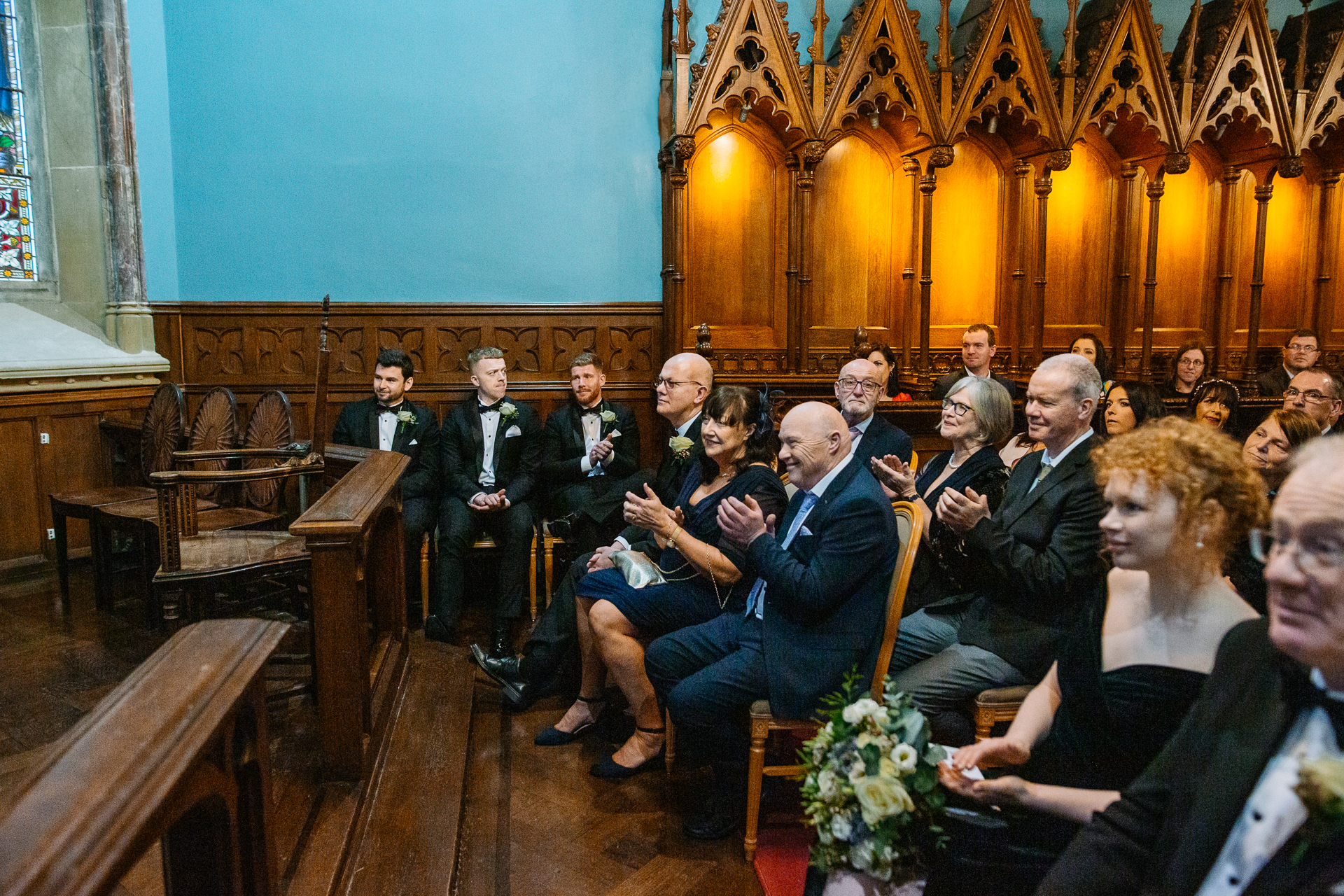 A group of people sitting in a church