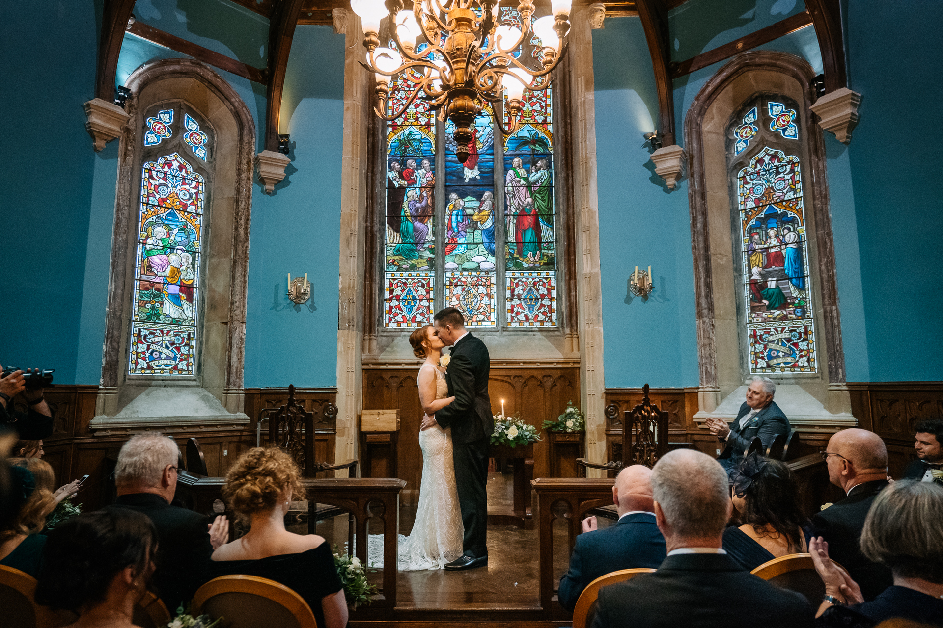 A man and woman kissing in a church