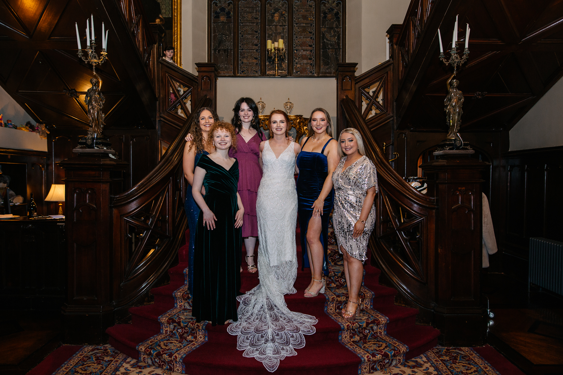 A group of women posing for a photo in a fancy room