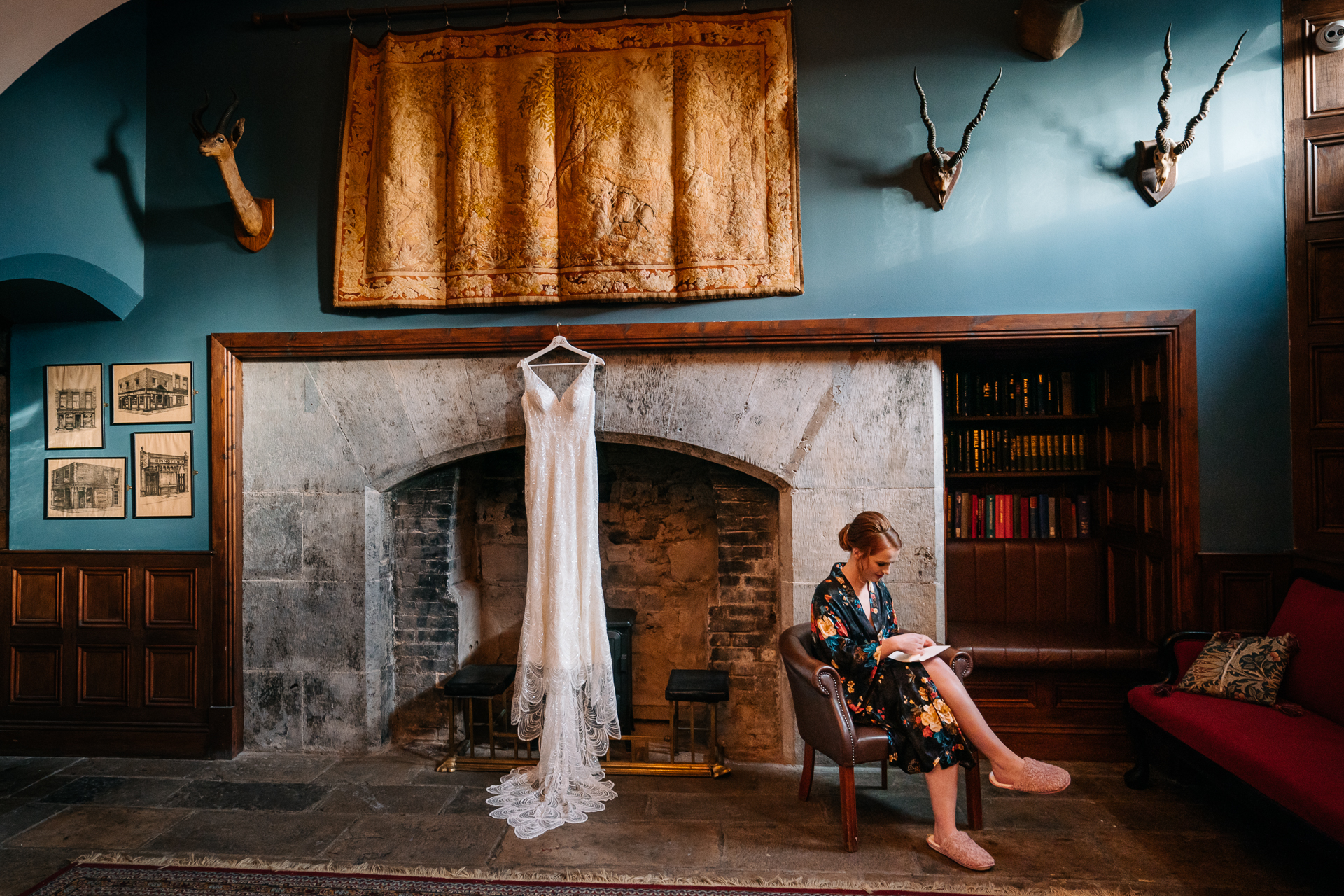 A person sitting in a chair in front of a fireplace