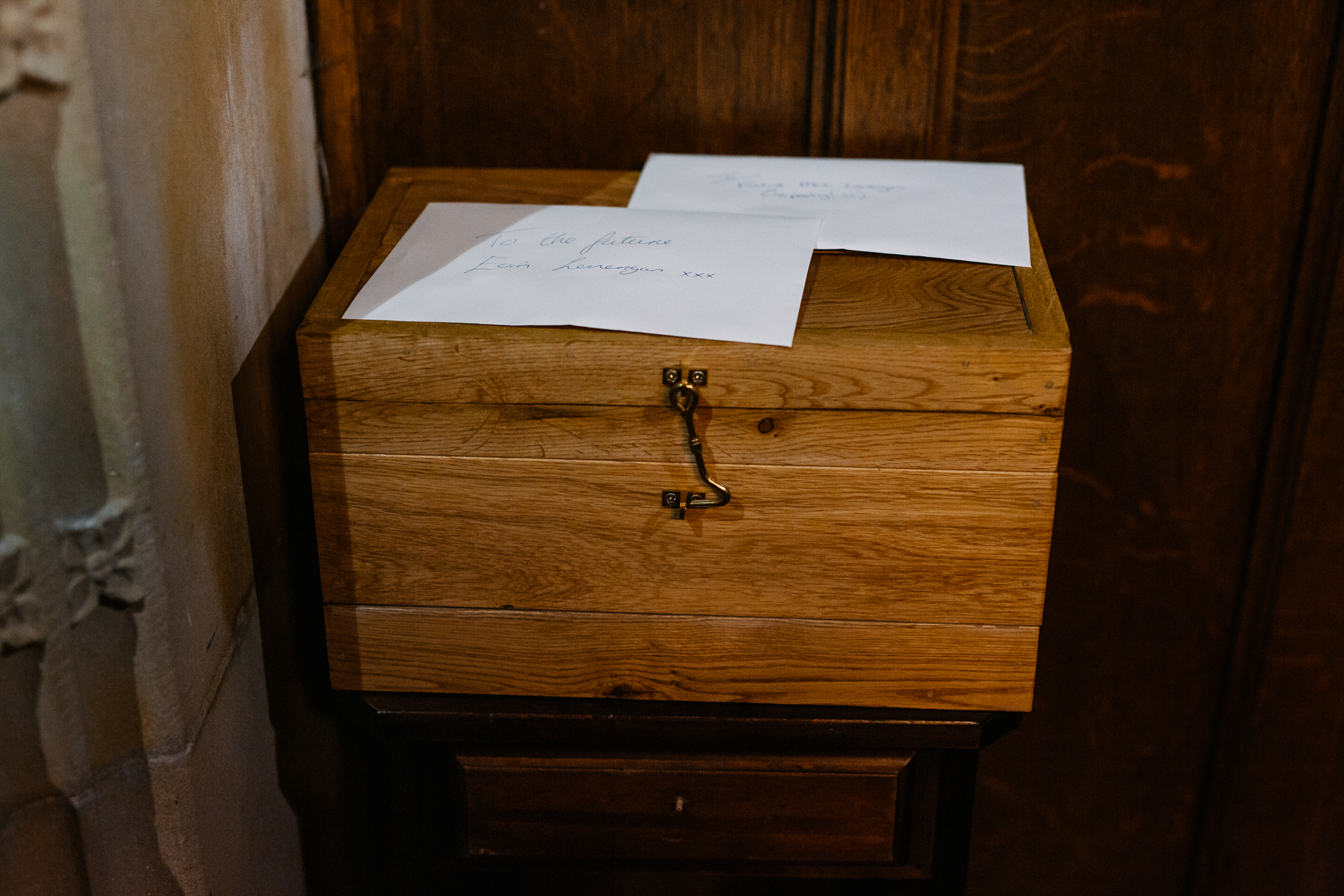 A wooden dresser with a note