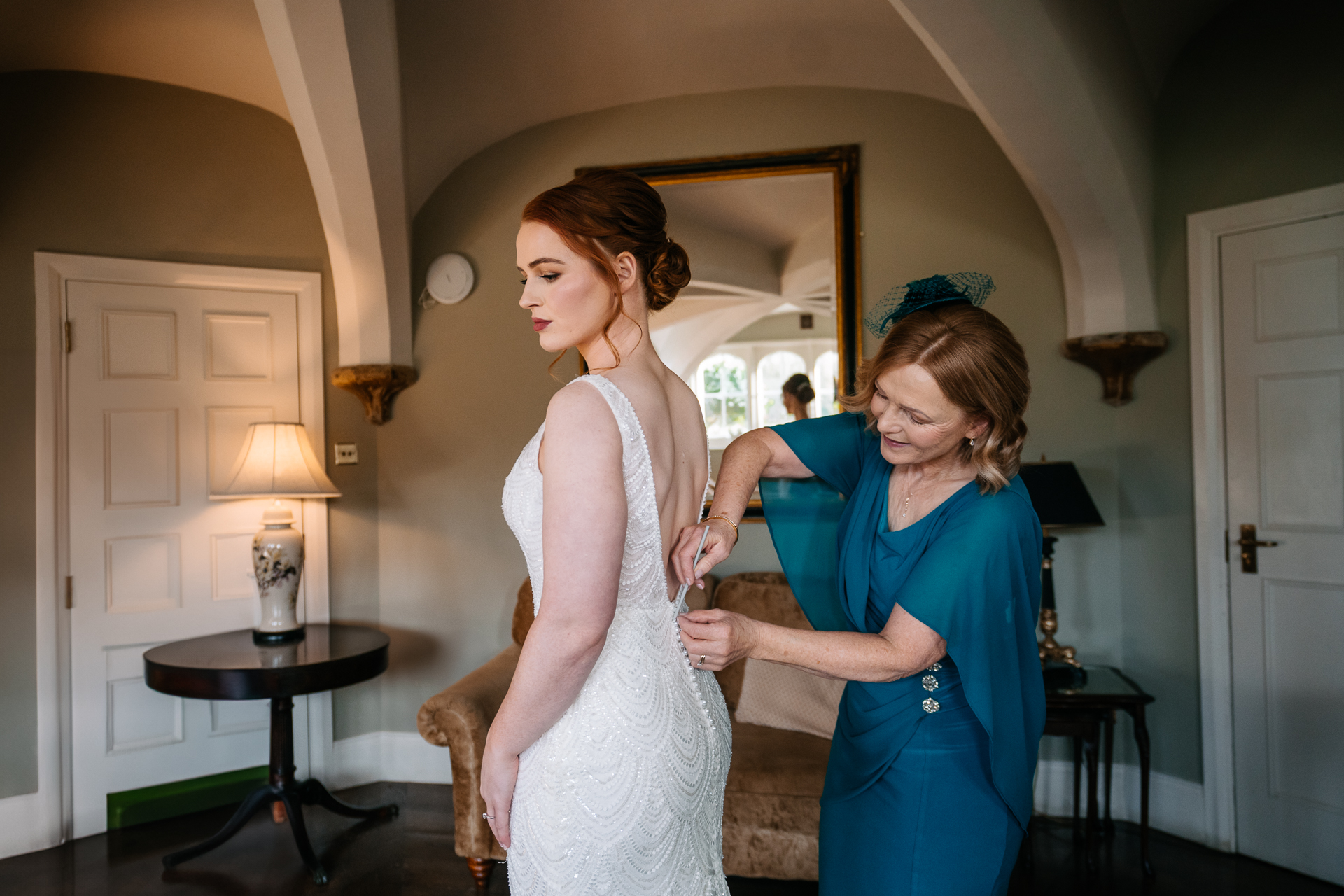 A person in a white dress and a person in a blue dress