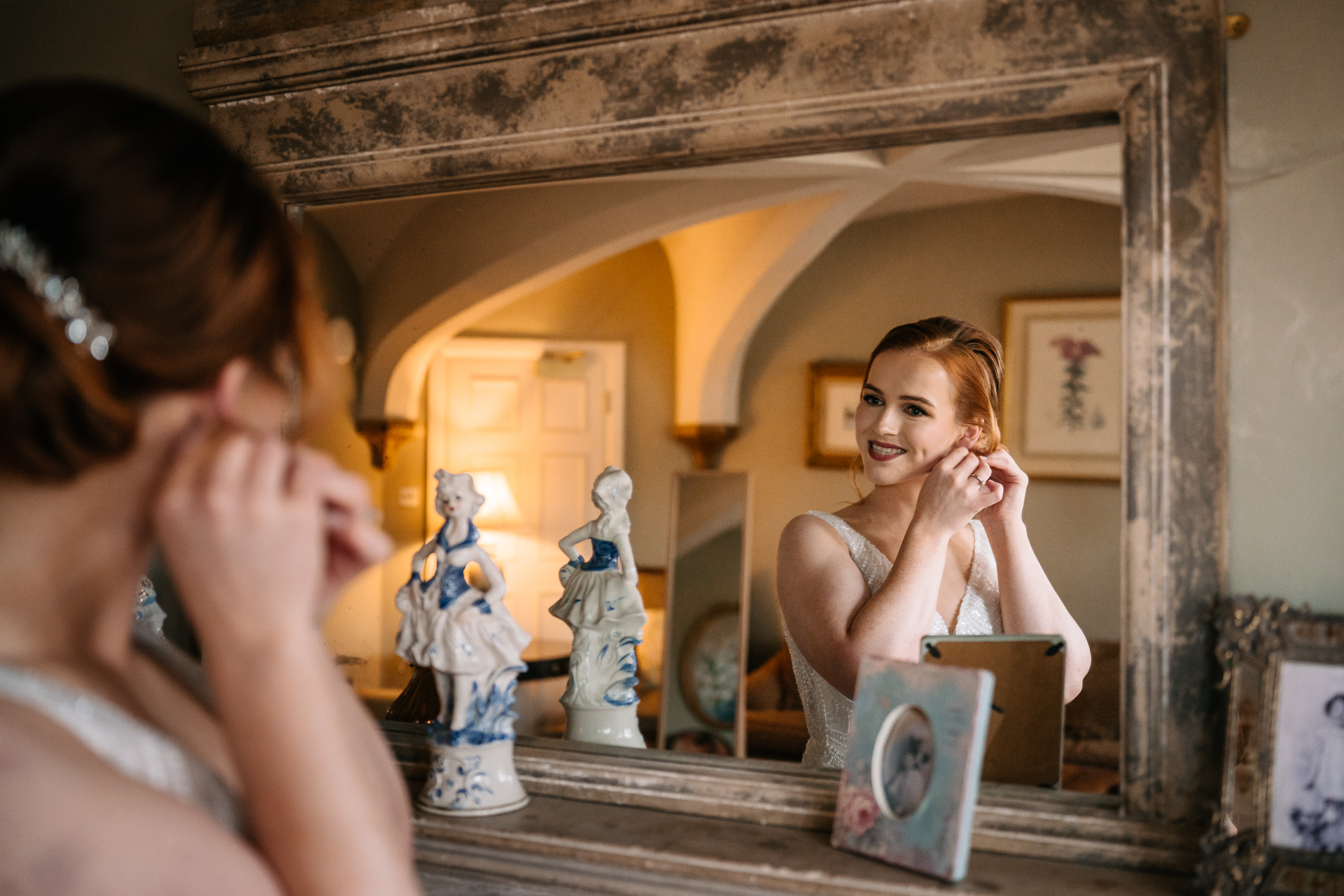 A woman looking at a mirror