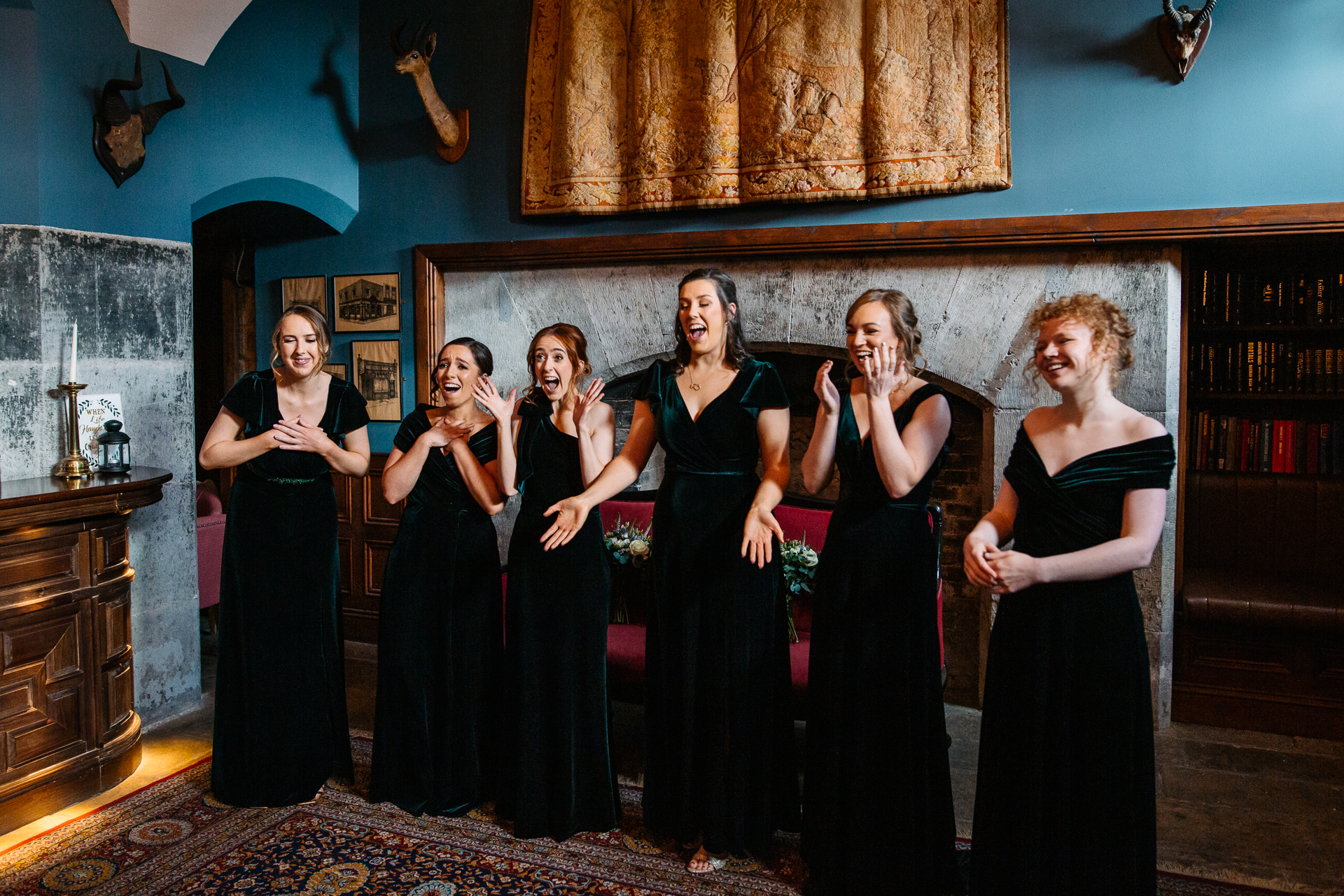 A group of women in black dresses