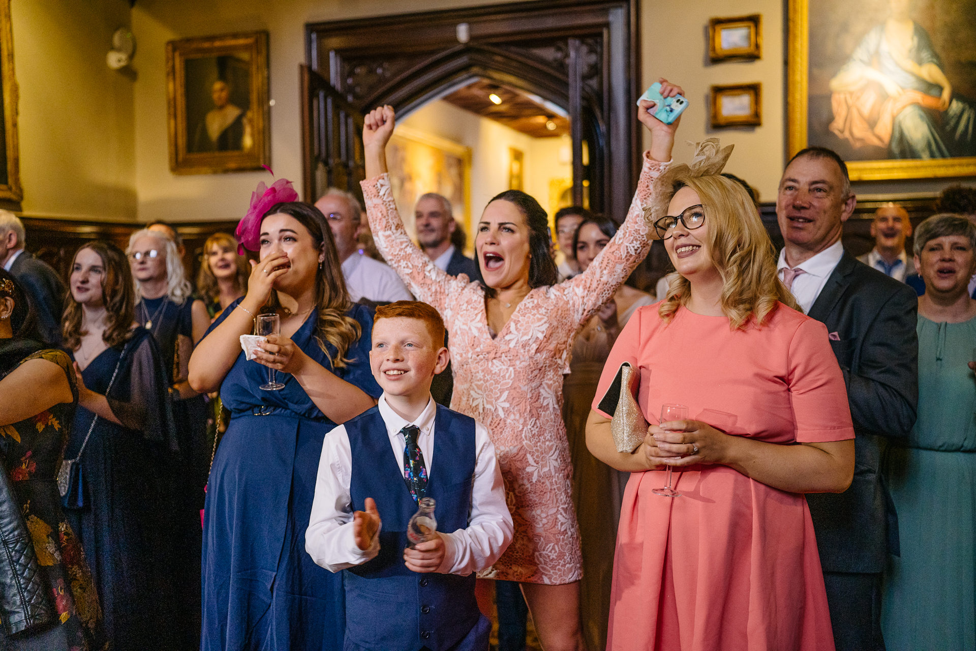 Wedding speeches during a same-sex wedding reception at Markree Castle, Ireland, featuring emotional and joyful moments shared by family and friends