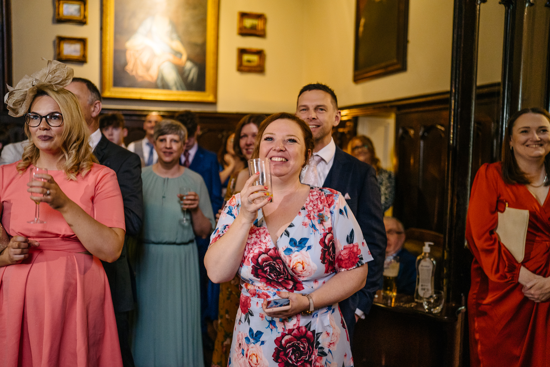 Wedding speeches during a same-sex wedding reception at Markree Castle, Ireland, featuring emotional and joyful moments shared by family and friends