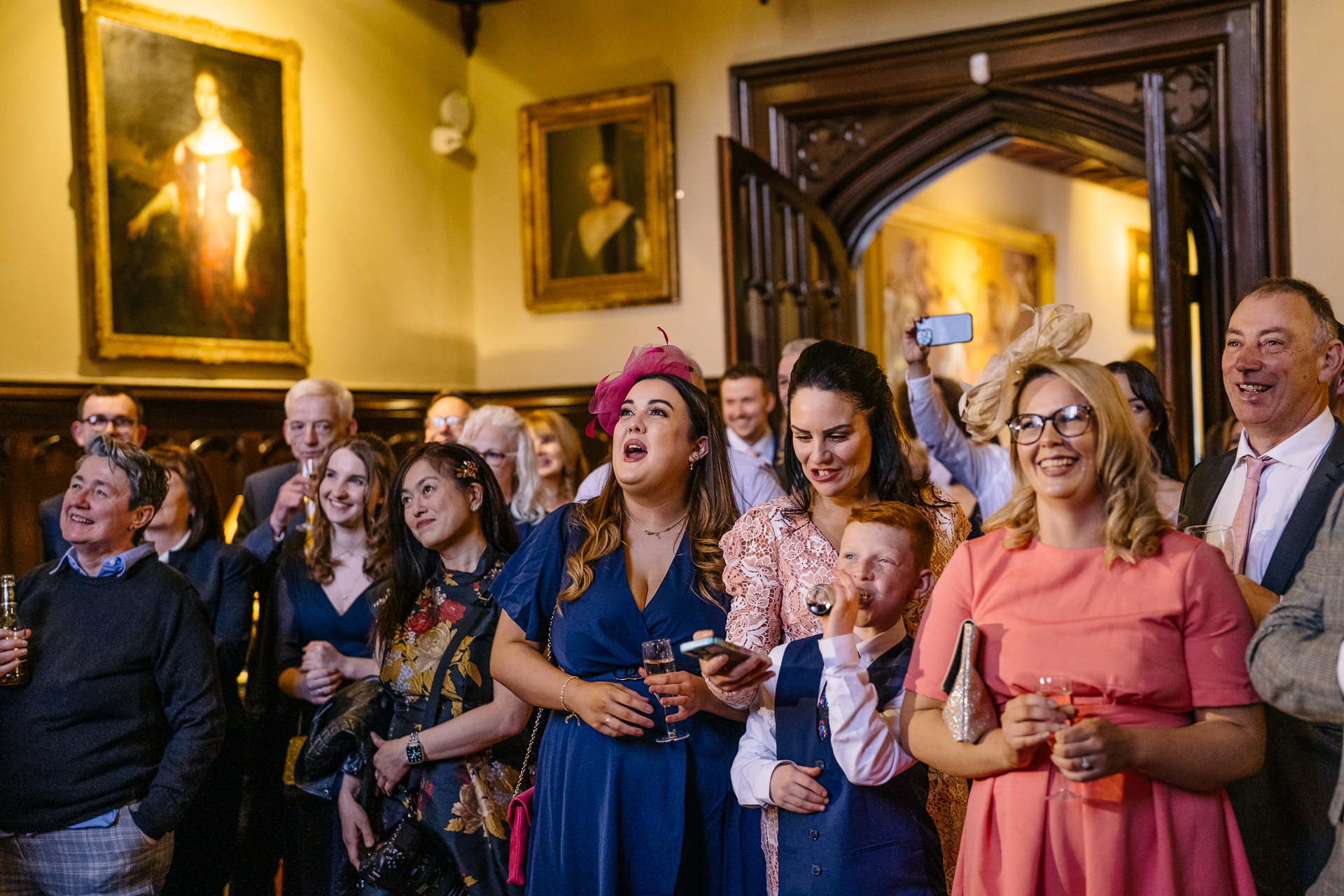 Wedding speeches during a same-sex wedding reception at Markree Castle, Ireland, featuring emotional and joyful moments shared by family and friends