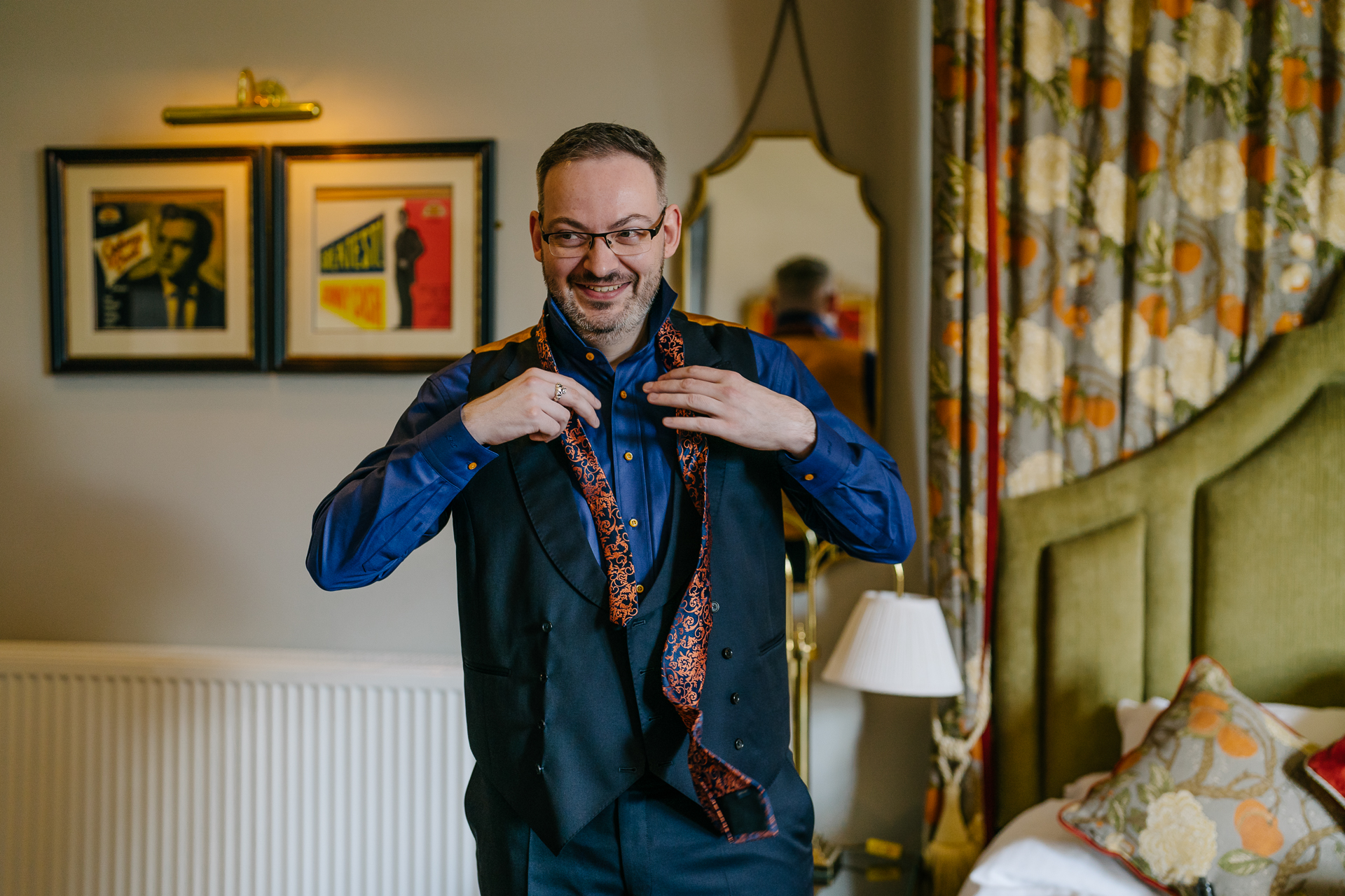 Two grooms preparing for their LGBT wedding in the bridal suite at Markree Castle, featuring elegant wedding details." "A groom adjusting his tie in the luxurious suite of Markree Castle." "Wedding details, including cufflinks and shoes, during the preparation of two grooms at Markree Castle"A groom adjusting his tie in the luxurious suite of Markree Castle." "Wedding details, including cufflinks and shoes, during the preparation of two grooms at Markree Castle