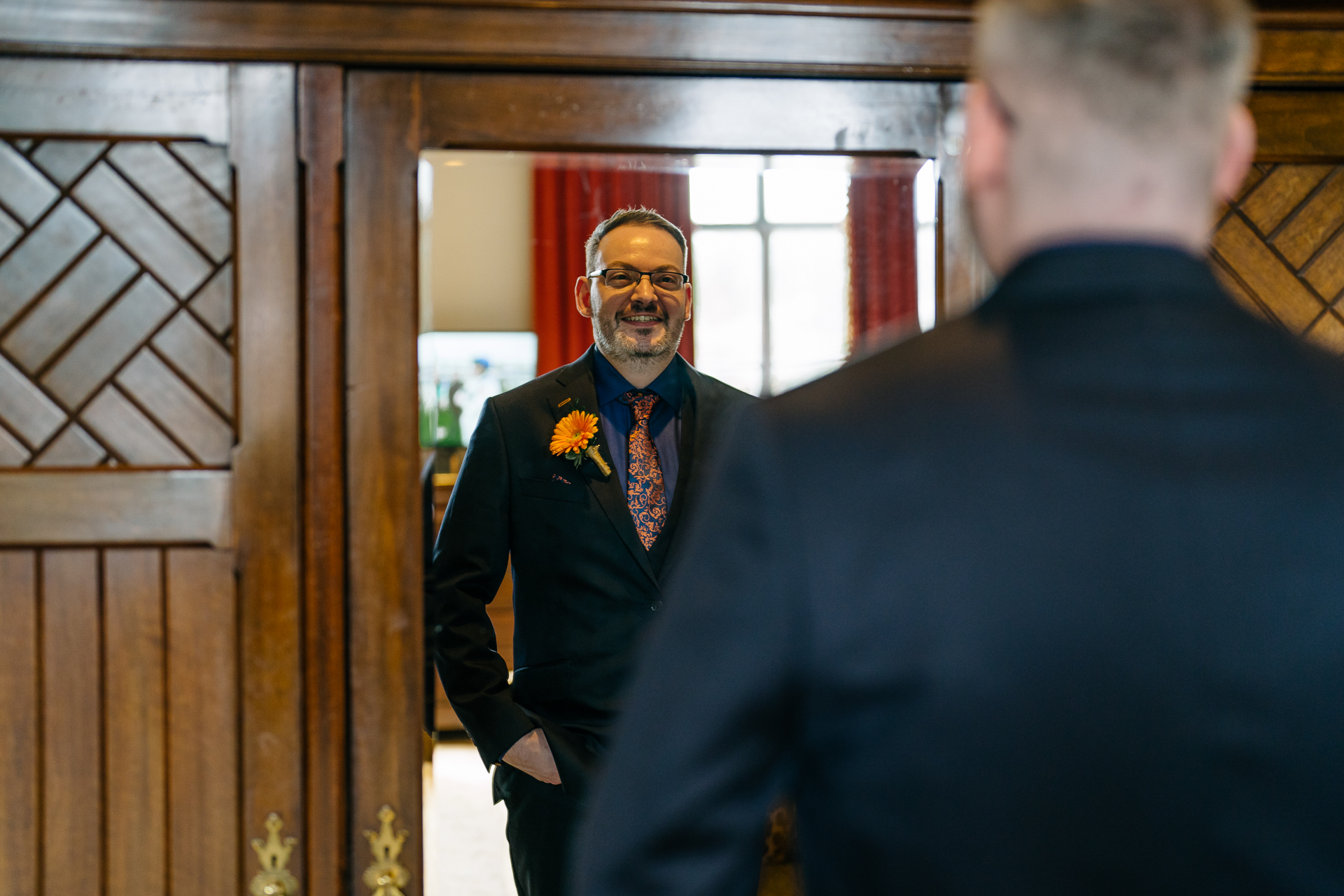 Two grooms preparing for their LGBT wedding in the bridal suite at Markree Castle, featuring elegant wedding details." "A groom adjusting his tie in the luxurious suite of Markree Castle." "Wedding details, including cufflinks and shoes, during the preparation of two grooms at Markree Castle"A groom adjusting his tie in the luxurious suite of Markree Castle." "Wedding details, including cufflinks and shoes, during the preparation of two grooms at Markree Castle