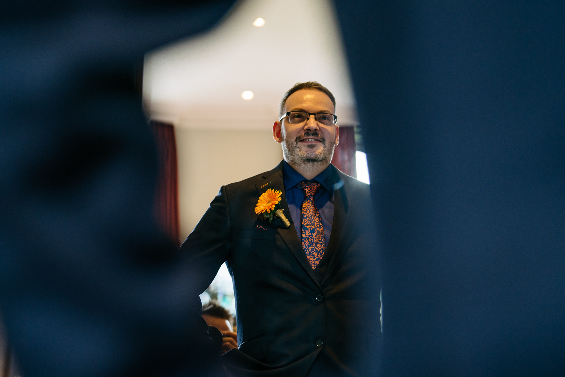 Two grooms preparing for their LGBT wedding in the bridal suite at Markree Castle, featuring elegant wedding details." "A groom adjusting his tie in the luxurious suite of Markree Castle." "Wedding details, including cufflinks and shoes, during the preparation of two grooms at Markree Castle"A groom adjusting his tie in the luxurious suite of Markree Castle." "Wedding details, including cufflinks and shoes, during the preparation of two grooms at Markree Castle