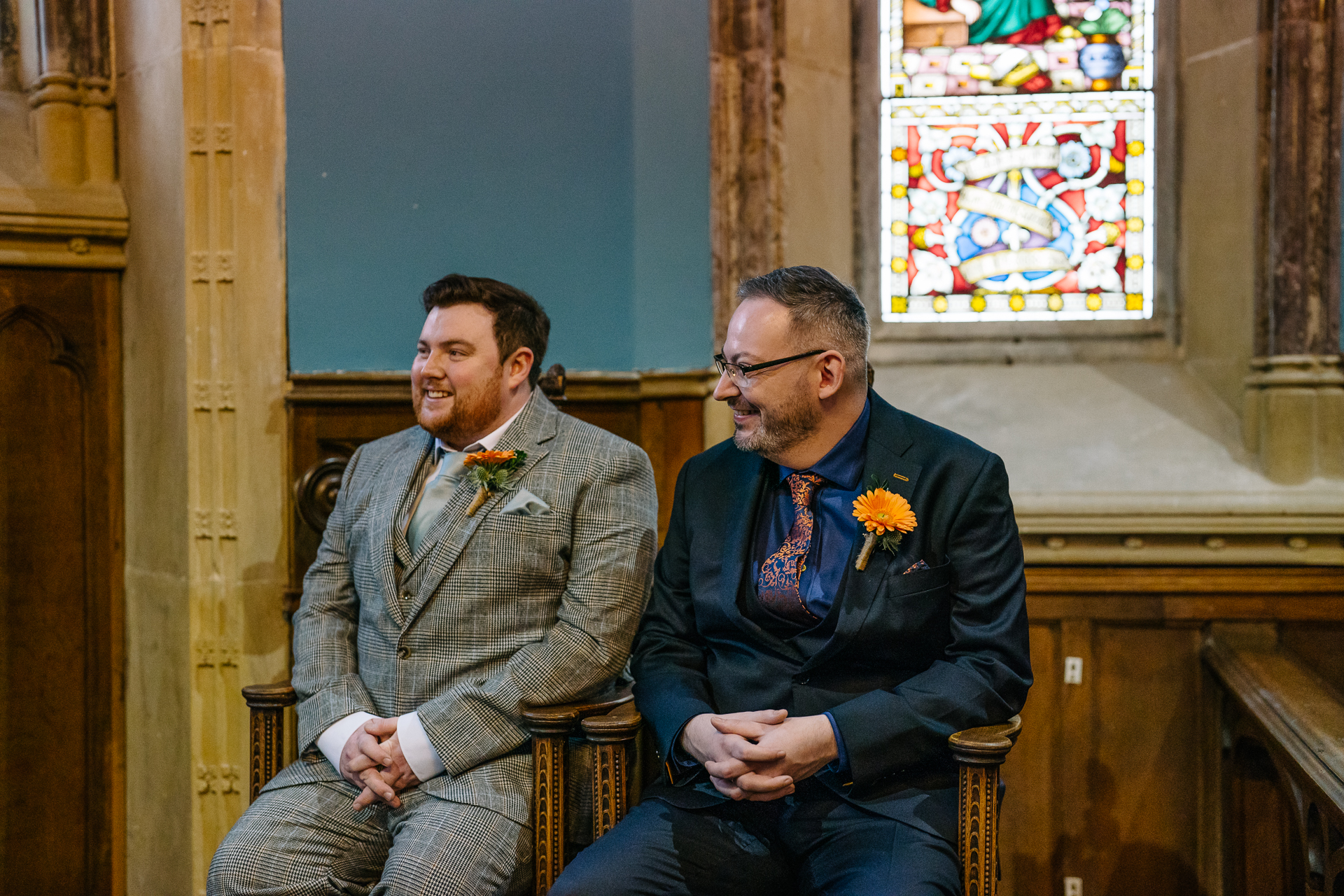 Two grooms exchanging vows during their LGBT wedding ceremony in the chapel of Markree Castle"A groom adjusting his tie in the luxurious suite of Markree Castle." "Wedding details, including cufflinks and shoes, during the preparation of two grooms at Markree Castle