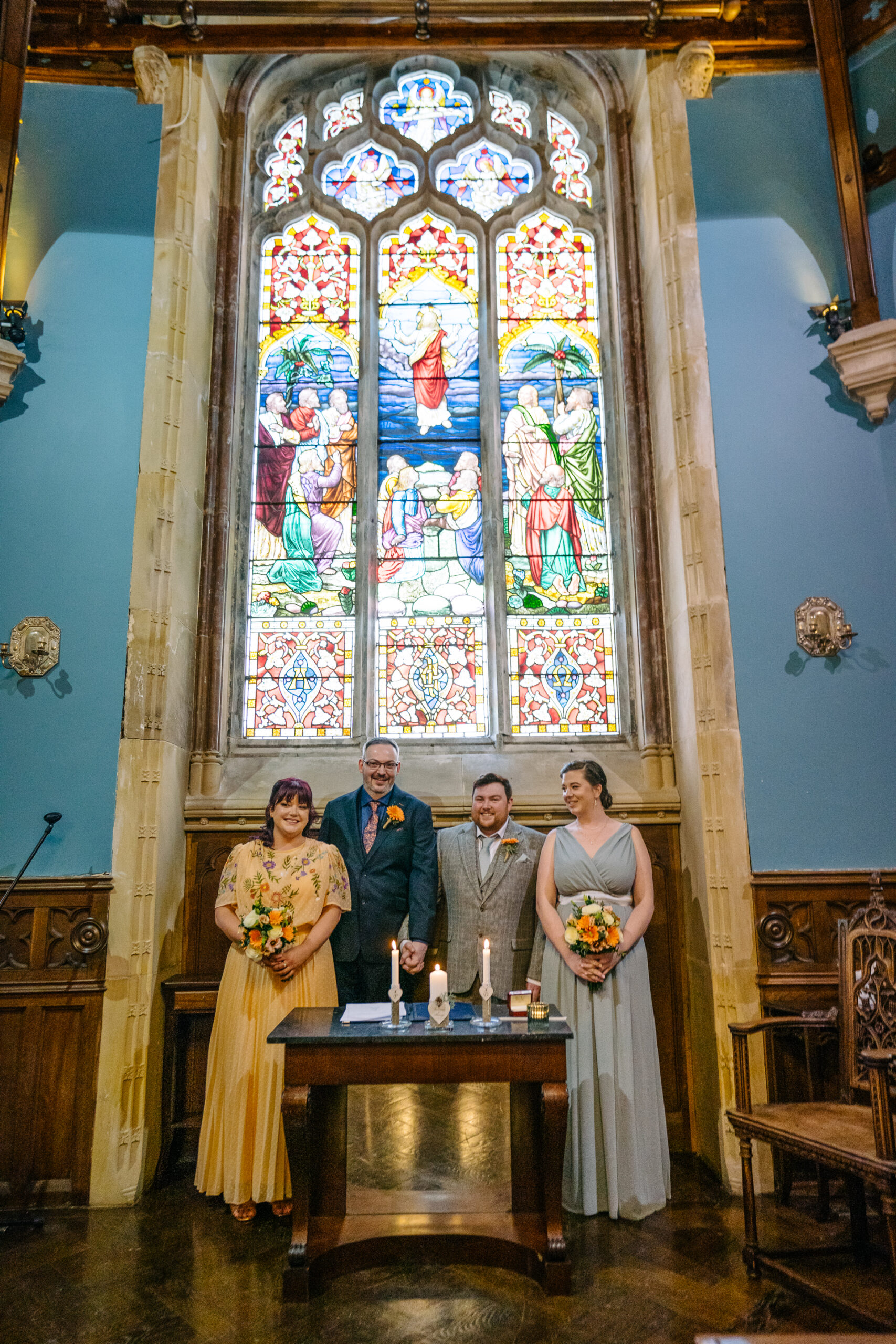 Two grooms exchanging vows during their LGBT wedding ceremony in the chapel of Markree Castle"A groom adjusting his tie in the luxurious suite of Markree Castle." "Wedding details, including cufflinks and shoes, during the preparation of two grooms at Markree Castle