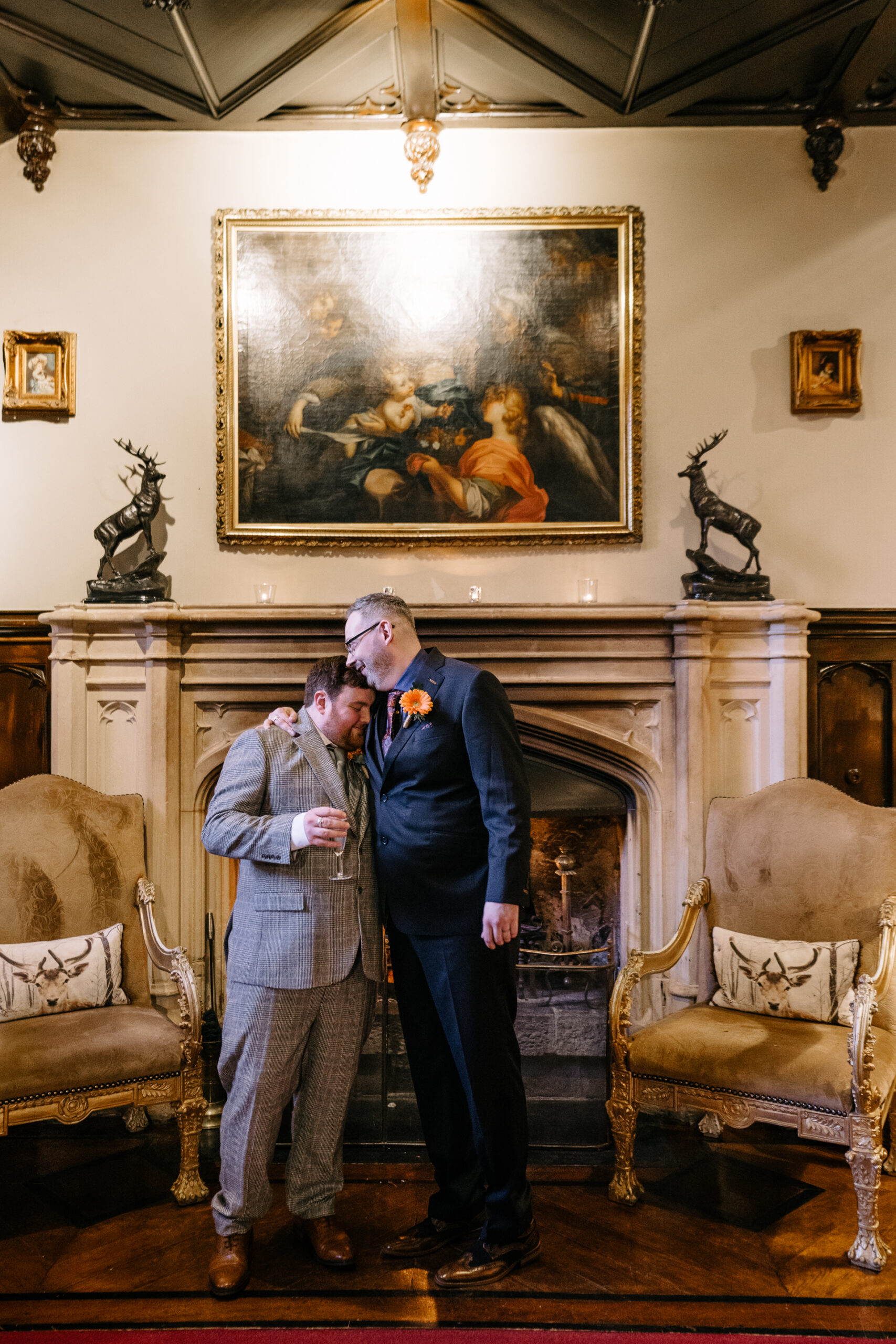 Two grooms exchanging vows during their LGBT wedding ceremony in the chapel of Markree Castle"A groom adjusting his tie in the luxurious suite of Markree Castle." "Wedding details, including cufflinks and shoes, during the preparation of two grooms at Markree Castle