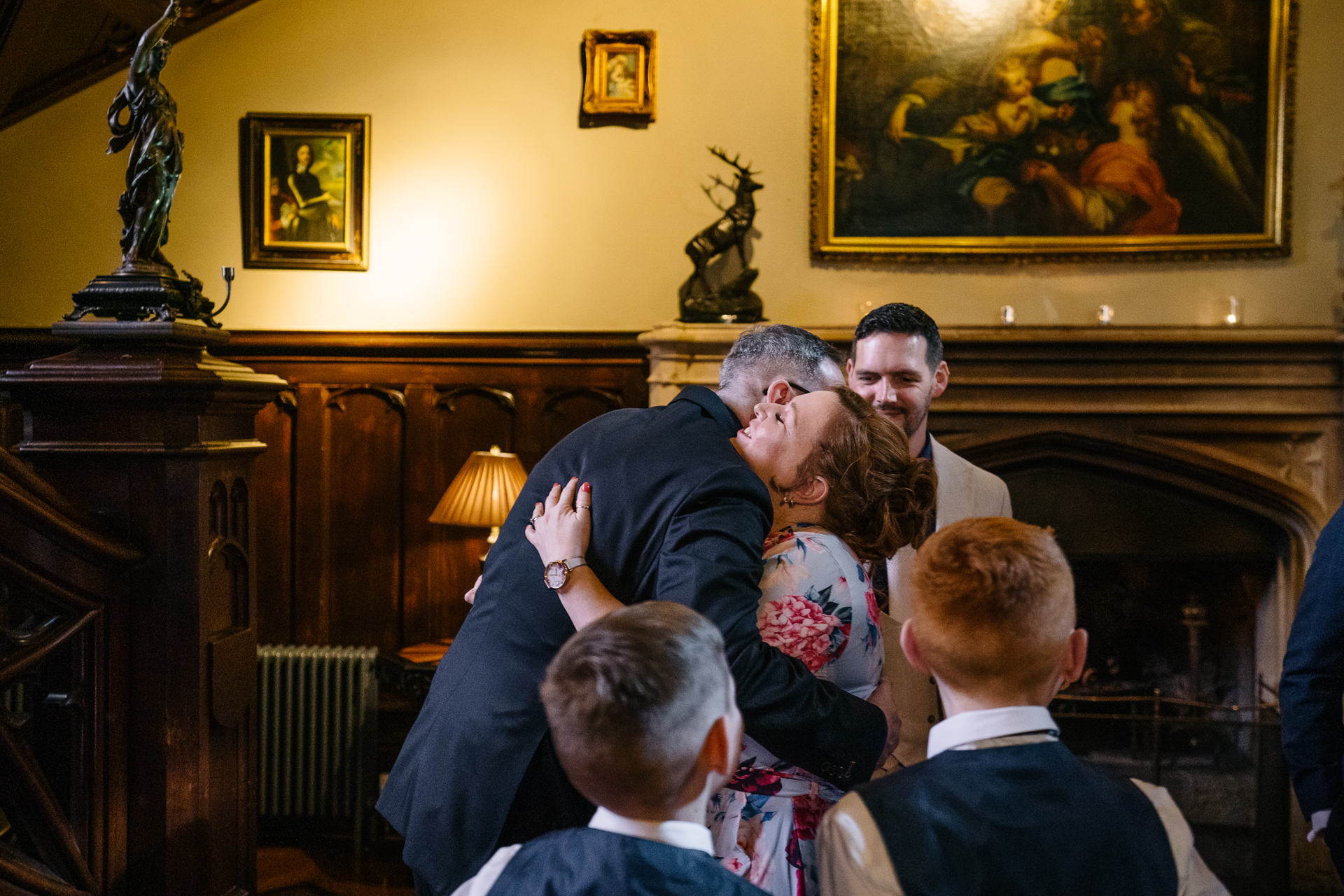 Two grooms exchanging vows during their LGBT wedding ceremony in the chapel of Markree Castle"A groom adjusting his tie in the luxurious suite of Markree Castle." "Wedding details, including cufflinks and shoes, during the preparation of two grooms at Markree Castle