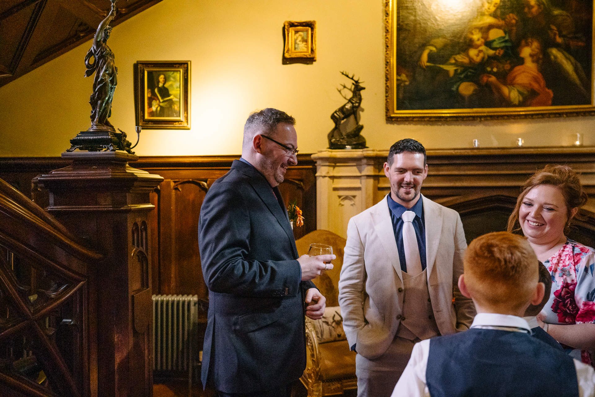 Two grooms exchanging vows during their LGBT wedding ceremony in the chapel of Markree Castle