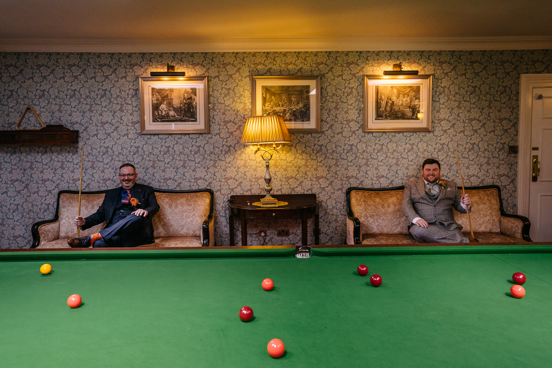 Candid wedding portraits of two grooms captured in the historic surroundings of Markree Castle