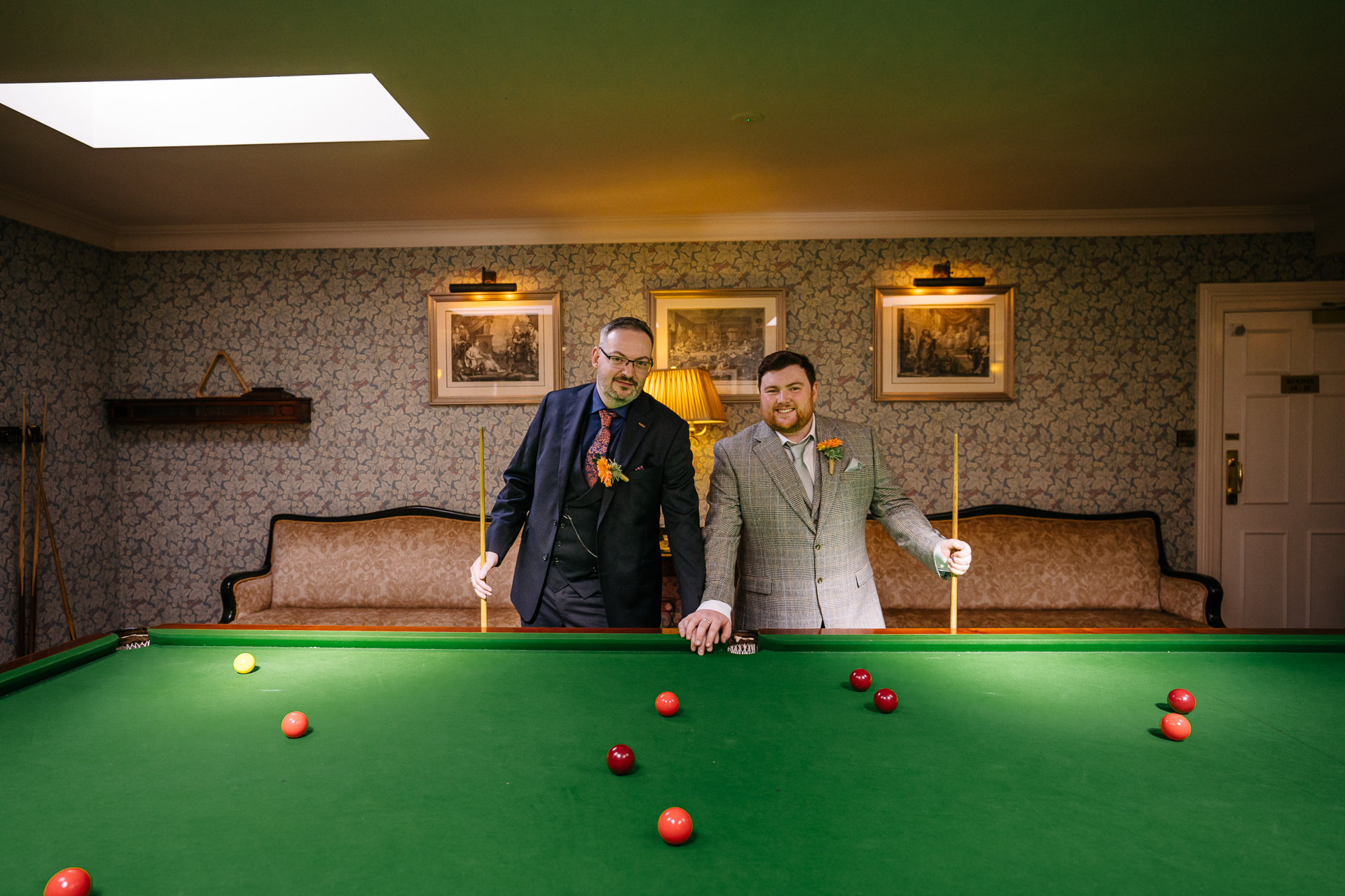 Candid wedding portraits of two grooms captured in the historic surroundings of Markree Castle.