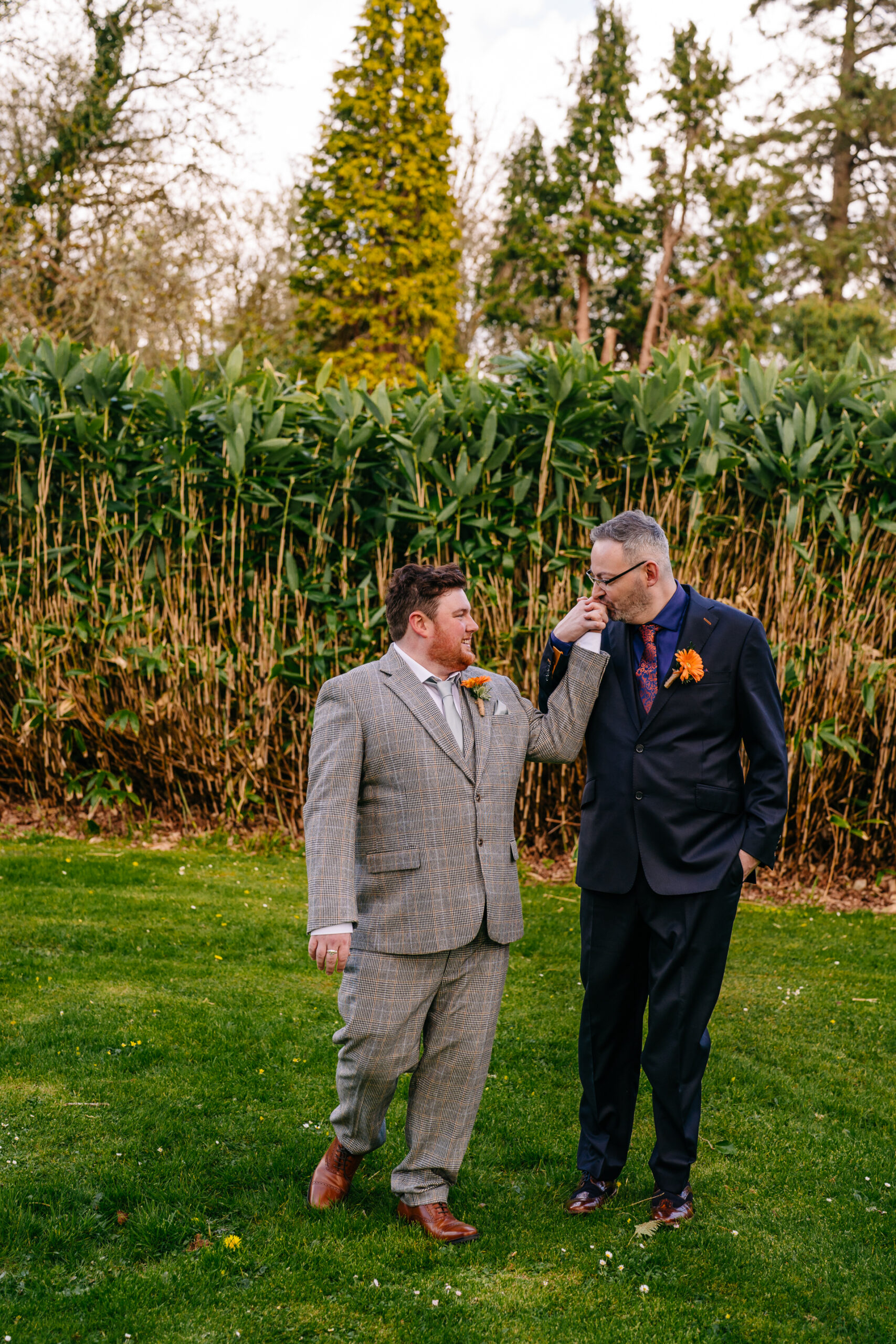 Two grooms posing for romantic wedding portraits in the gardens of Markree Castle