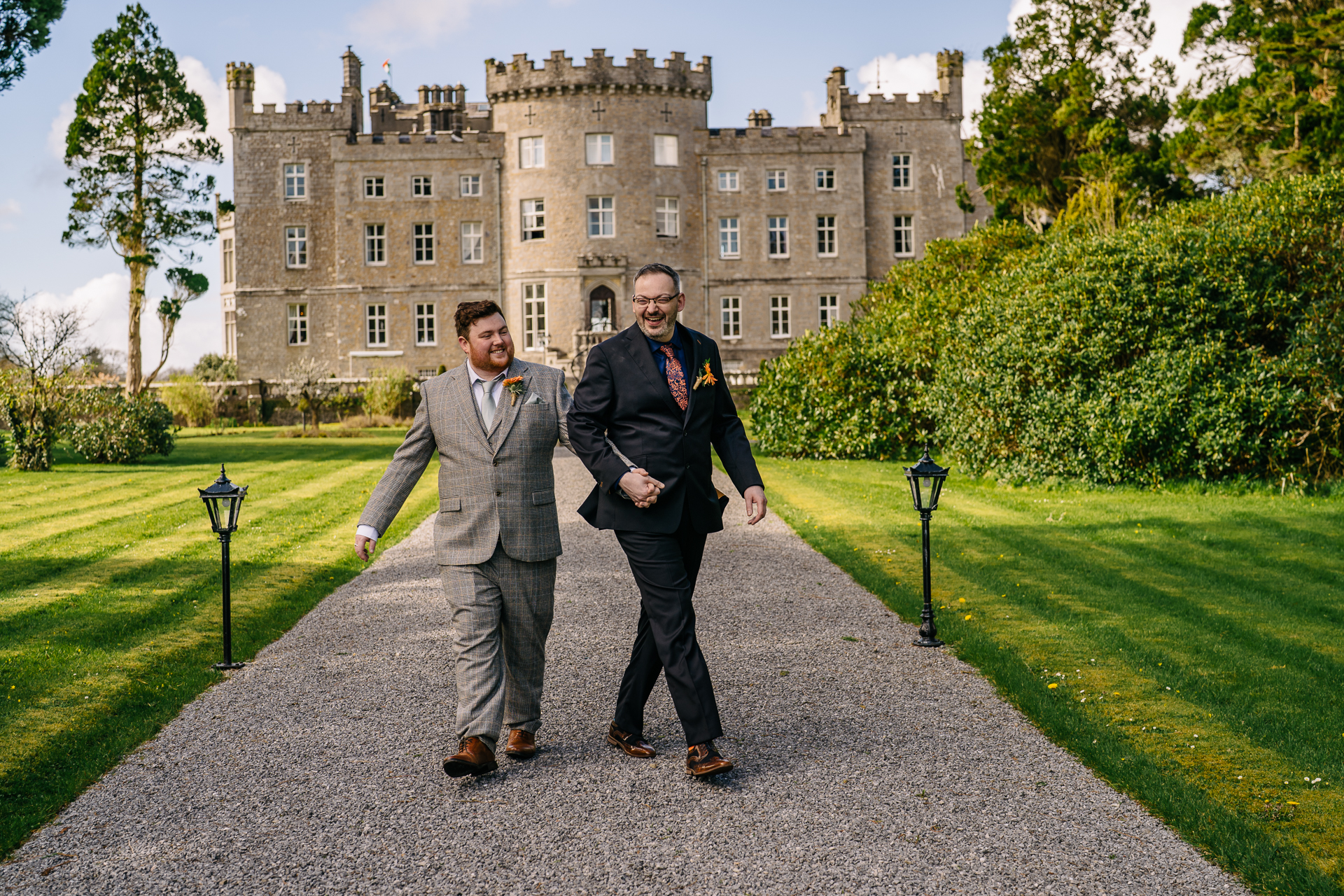 Two grooms posing for romantic wedding portraits in the gardens of Markree Castle