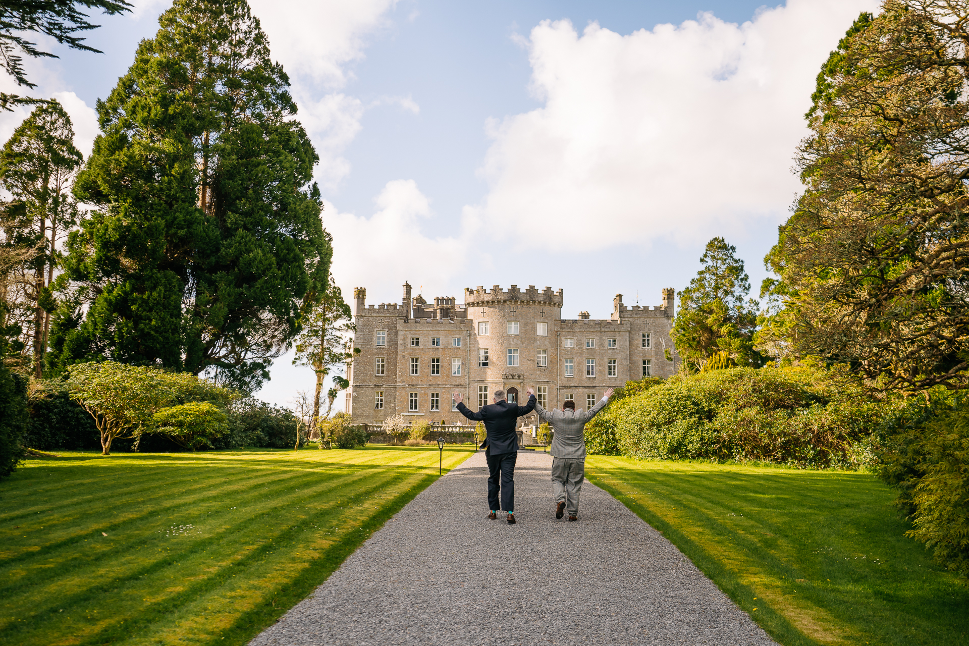 Two grooms posing for romantic wedding portraits in the gardens of Markree Castle