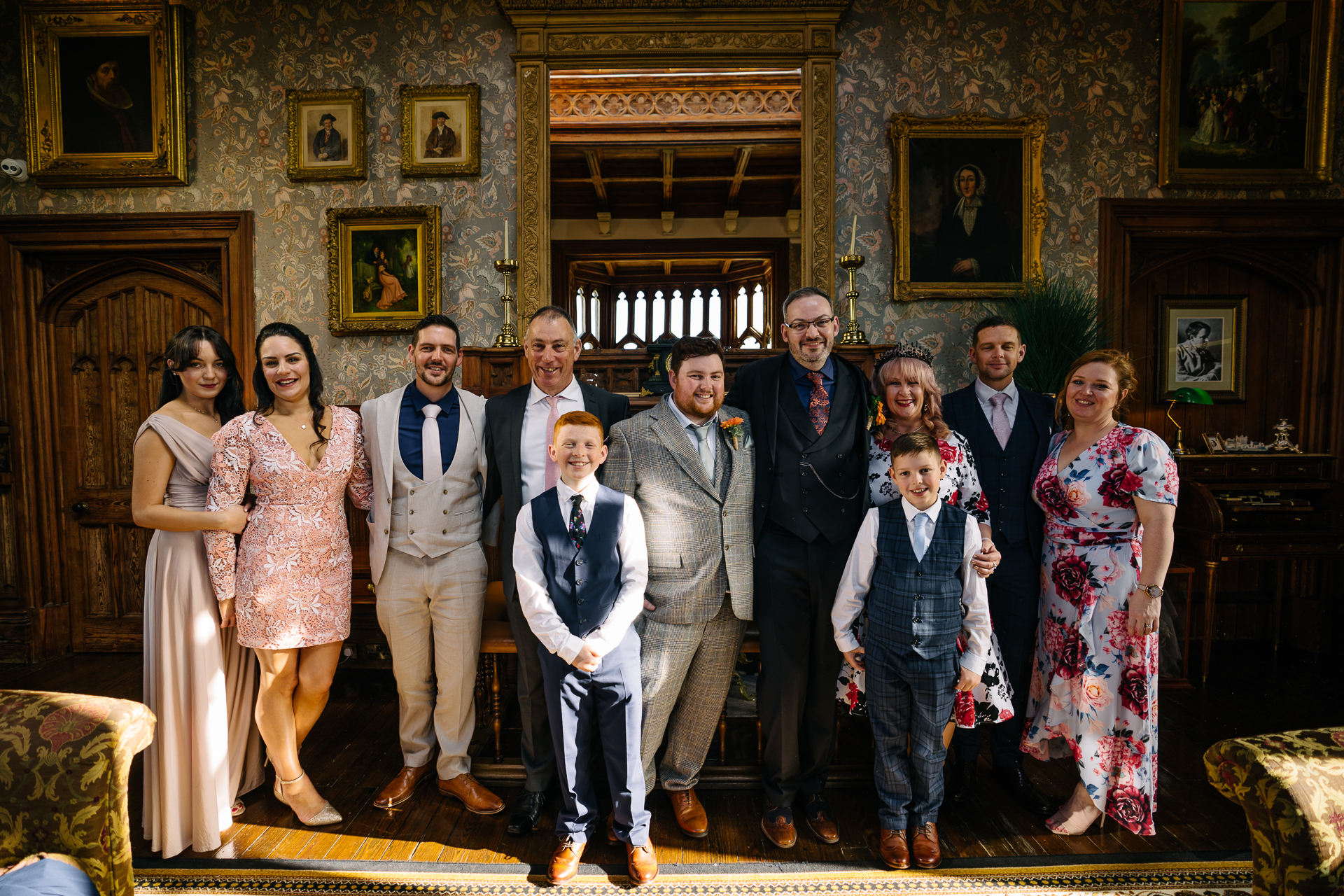 Two grooms enjoying their wedding reception at Markree Castle’s grand hall