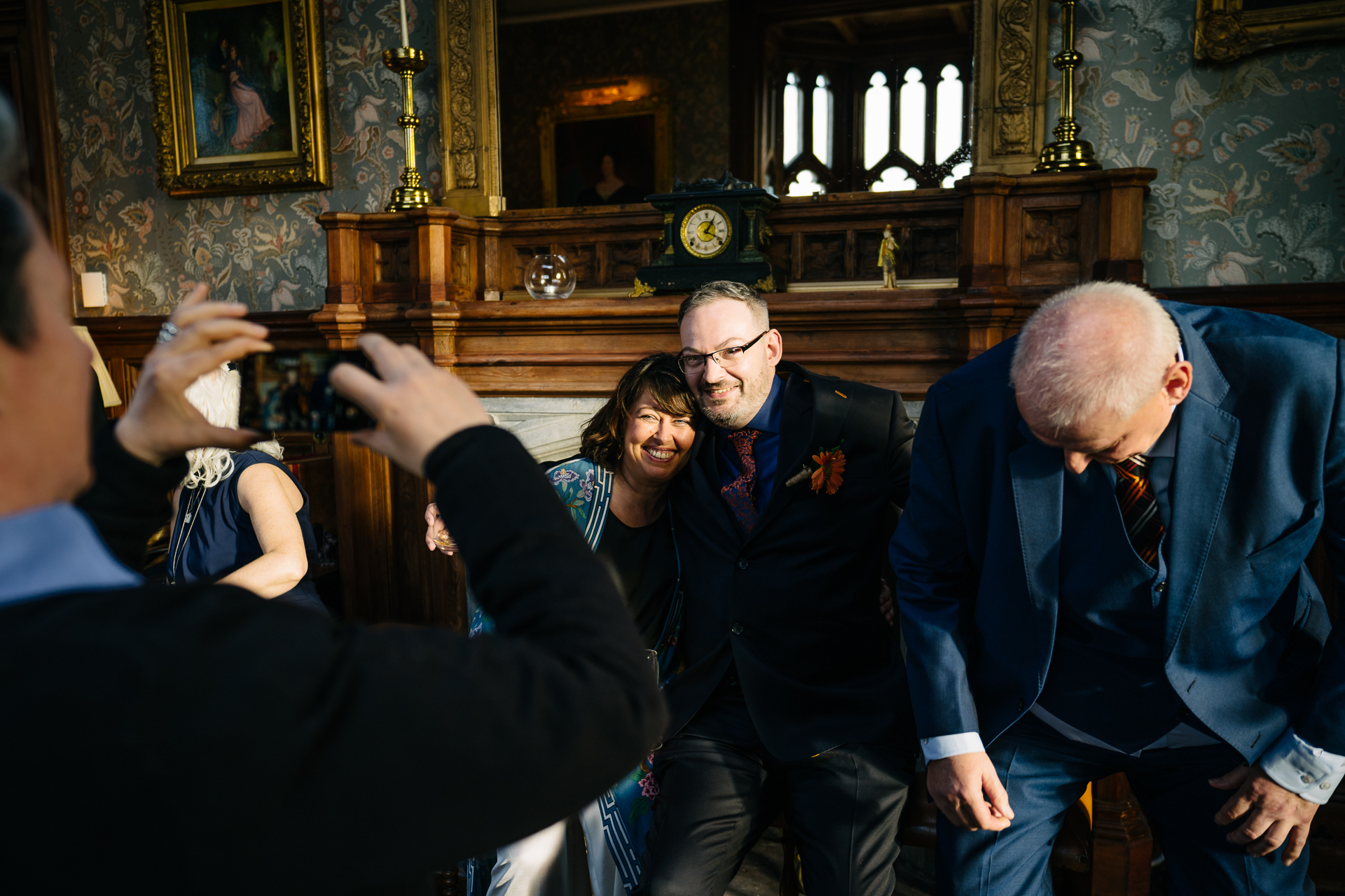 Two grooms enjoying their wedding reception at Markree Castle’s grand hall