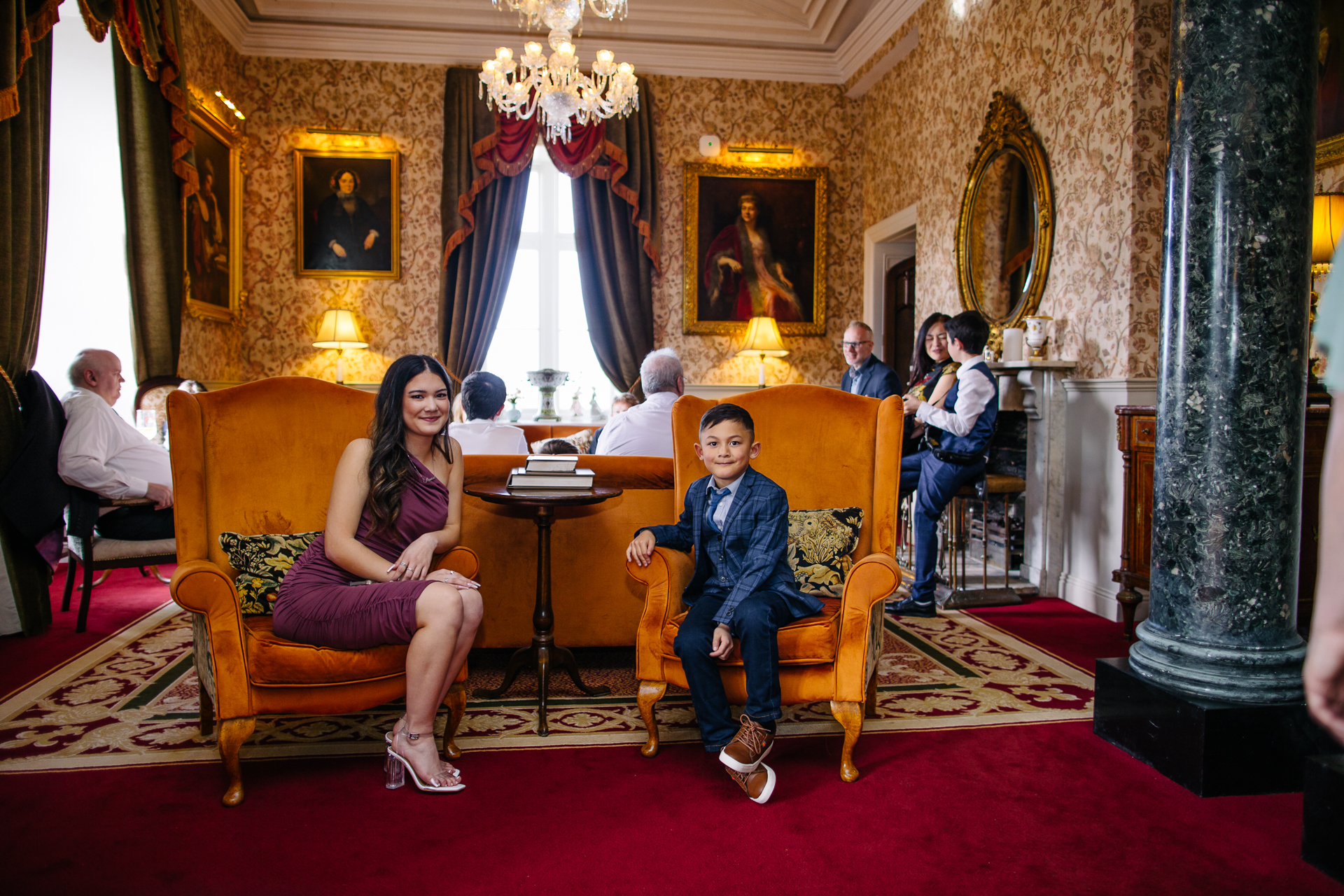 Two grooms enjoying their wedding reception at Markree Castle’s grand hall