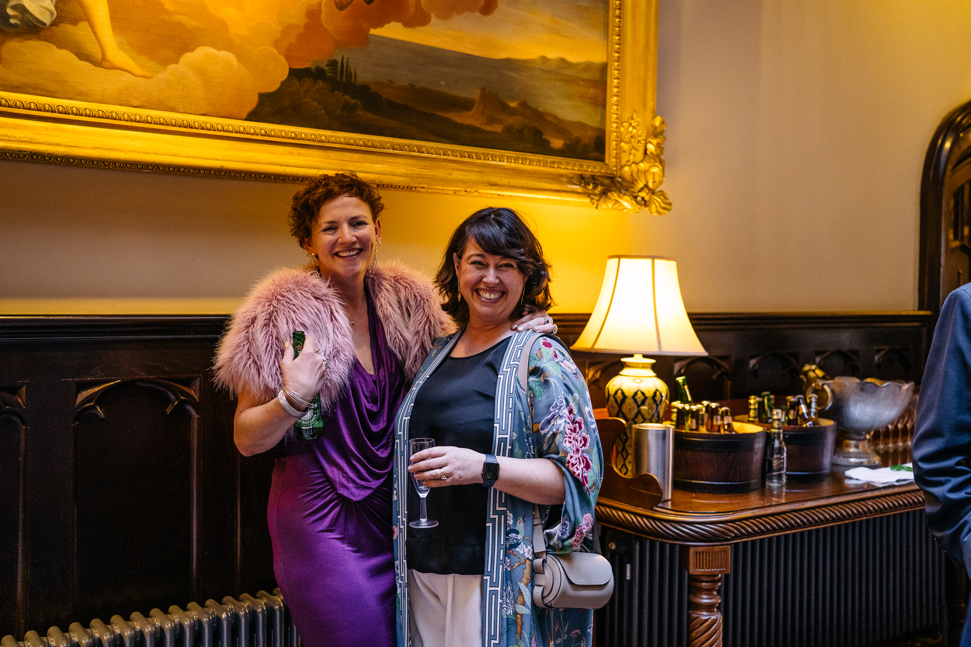 Two grooms enjoying their wedding reception at Markree Castle’s grand hall