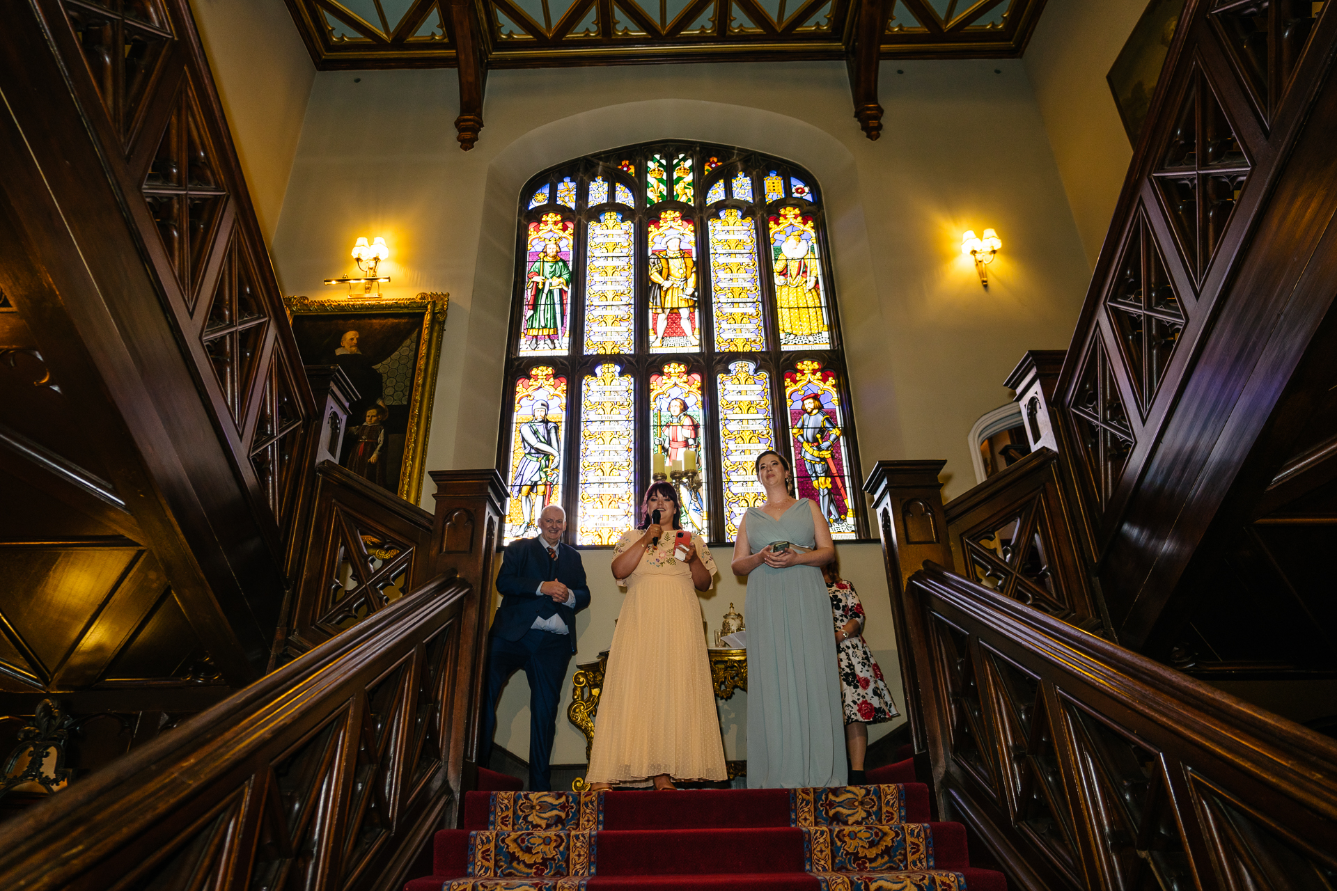 Wedding speeches during a same-sex wedding reception at Markree Castle, Ireland, featuring emotional and joyful moments shared by family and friends