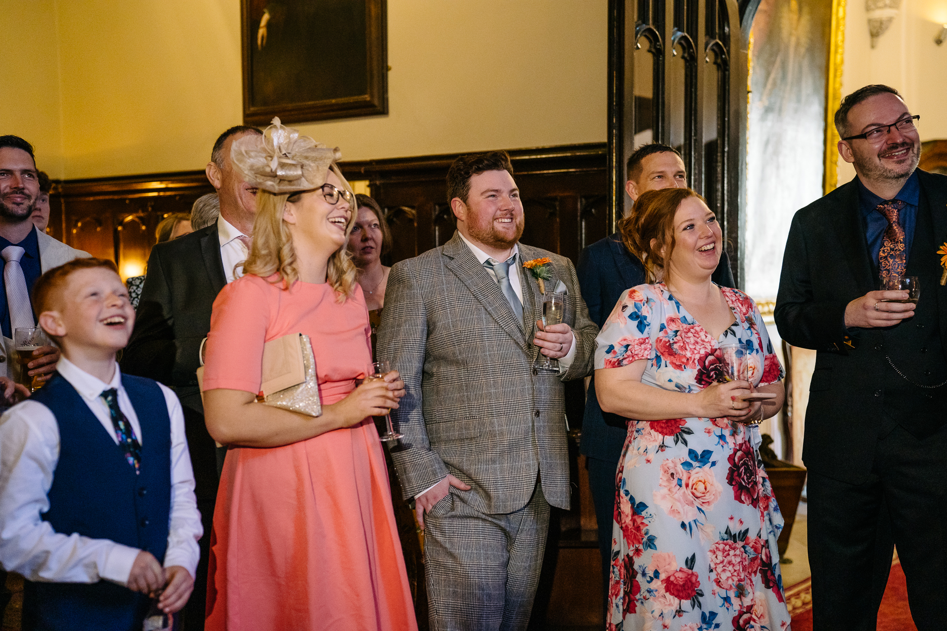 Wedding speeches during a same-sex wedding reception at Markree Castle, Ireland, featuring emotional and joyful moments shared by family and friends