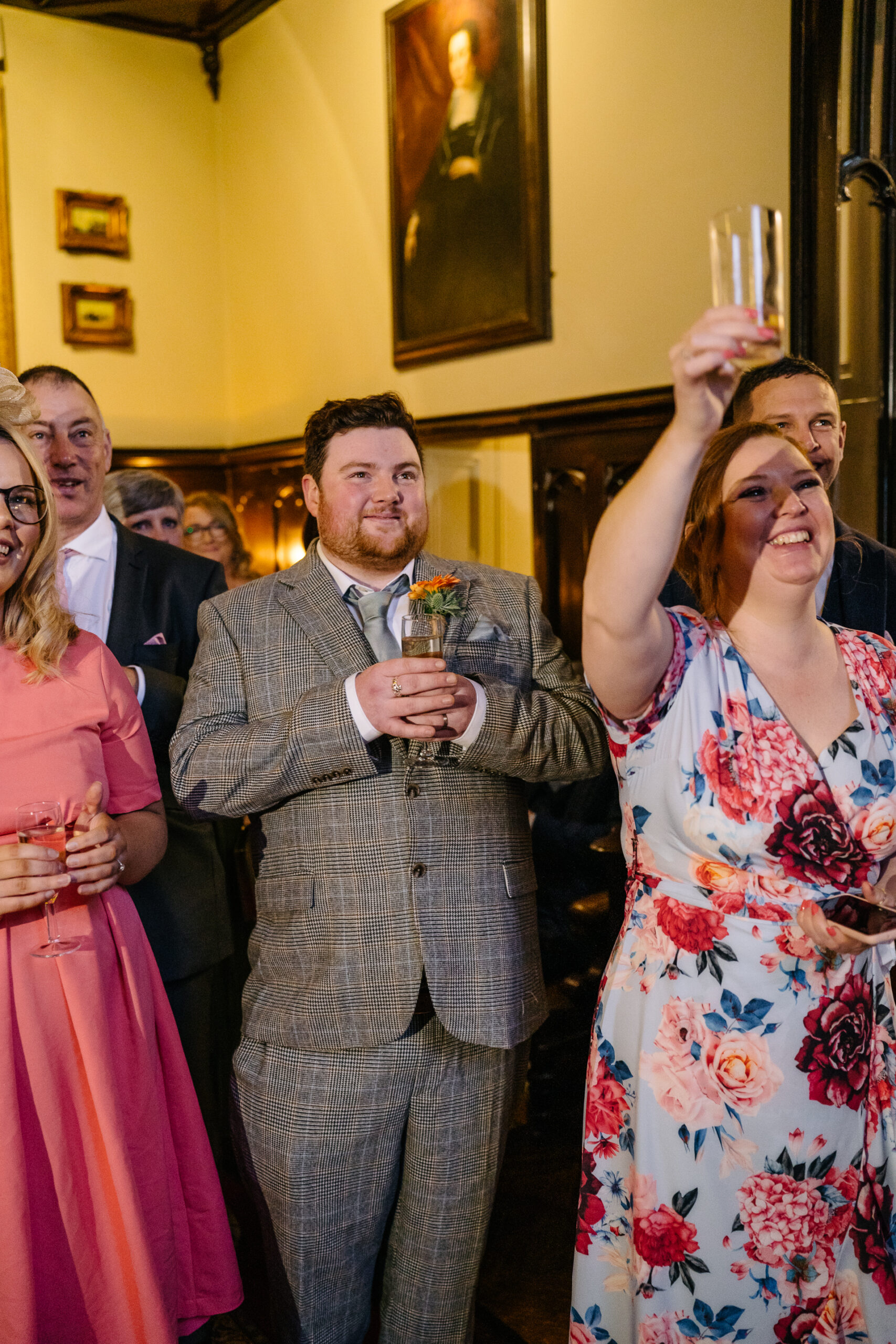 Wedding speeches during a same-sex wedding reception at Markree Castle, Ireland, featuring emotional and joyful moments shared by family and friends