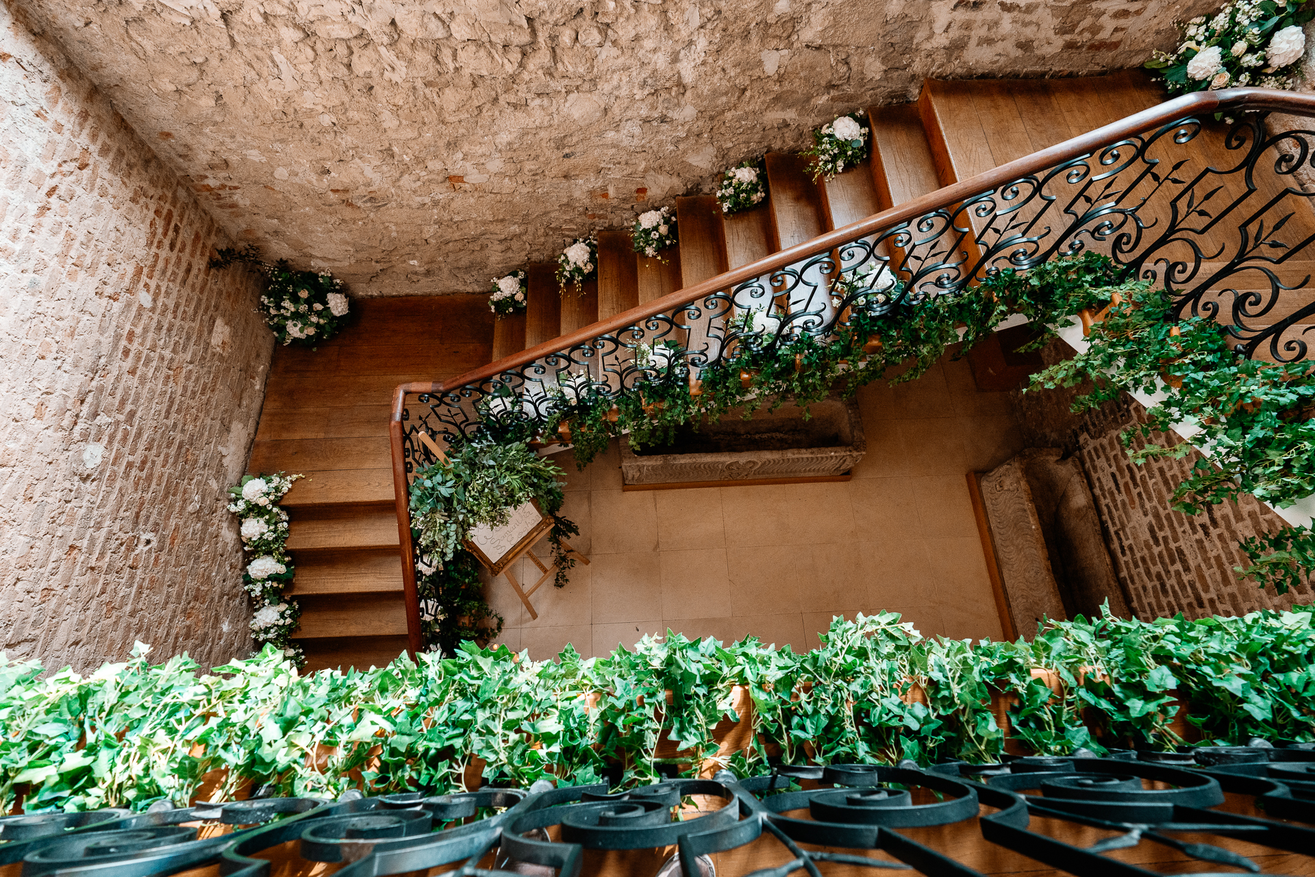 A balcony with plants and flowers