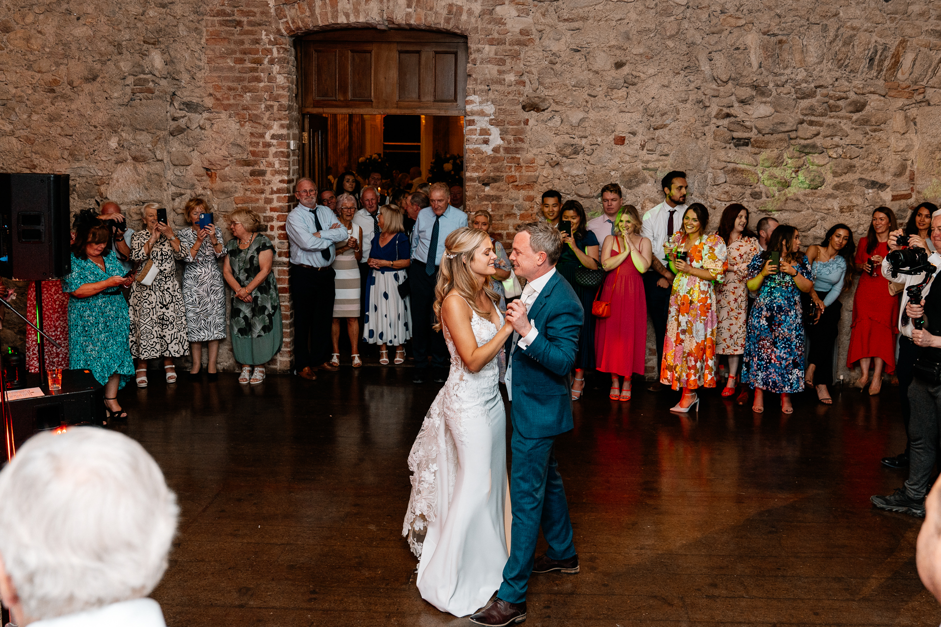 A man and woman dancing in front of a crowd of people