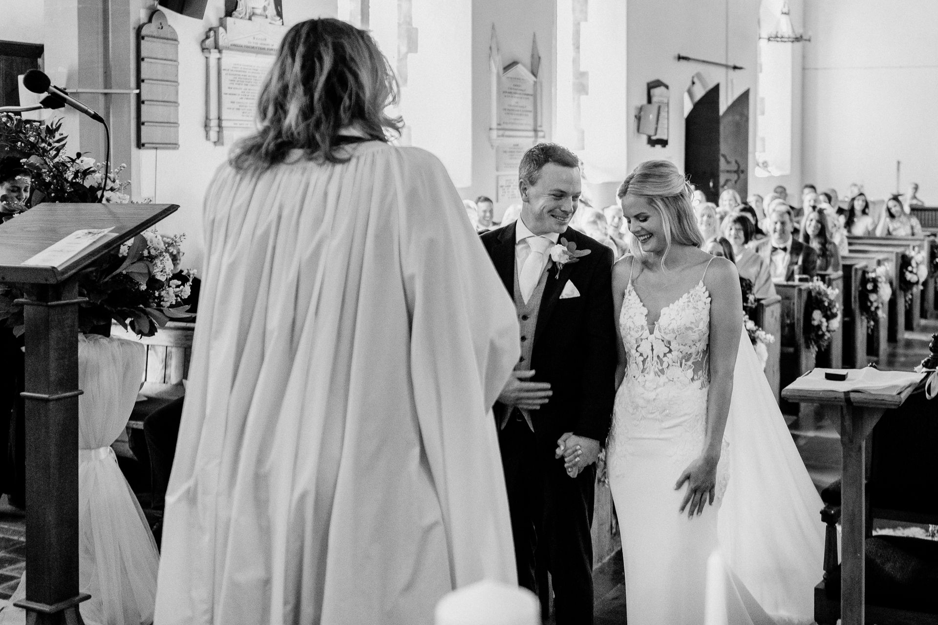 A bride and groom walking down the aisle