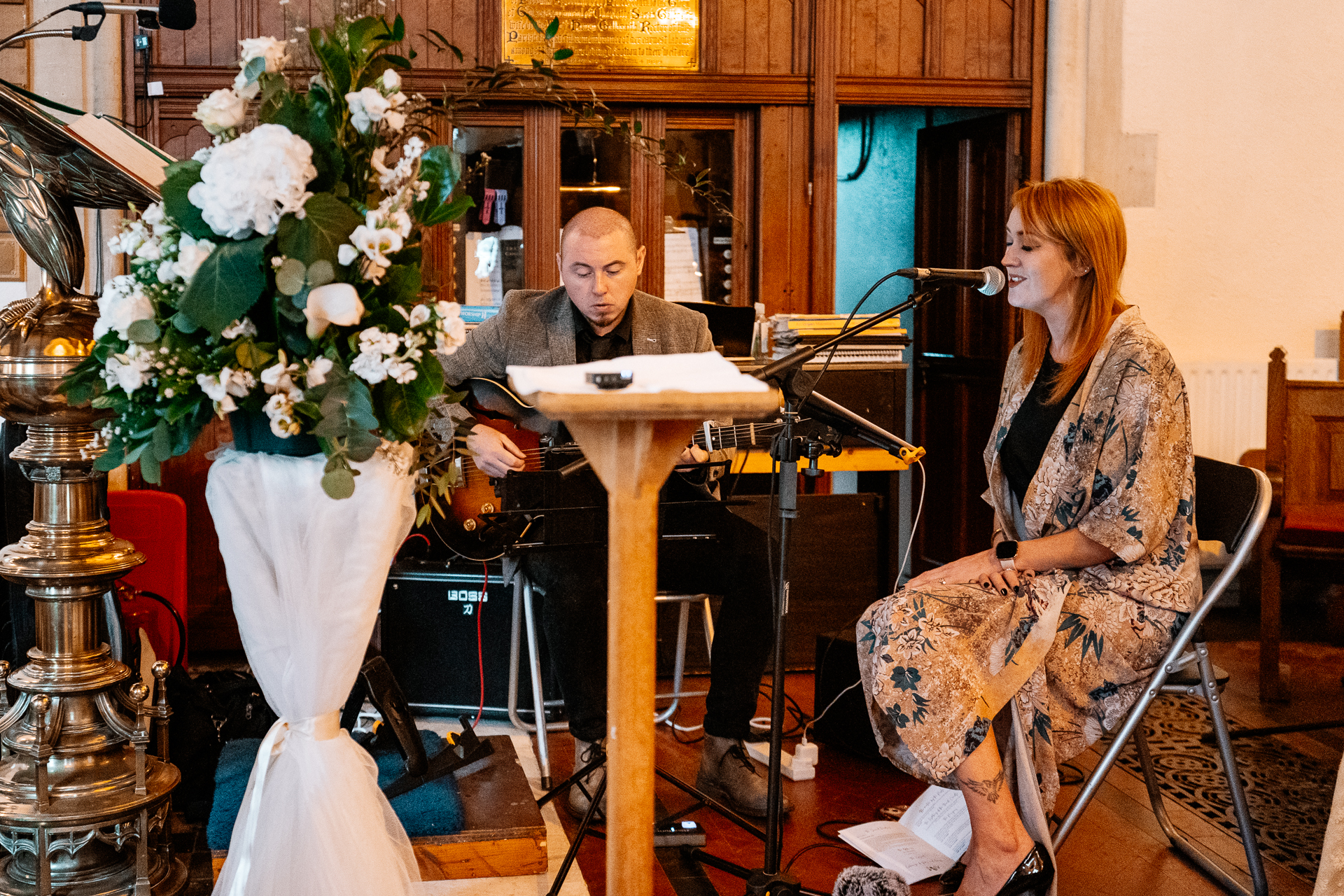 A man and woman playing the piano