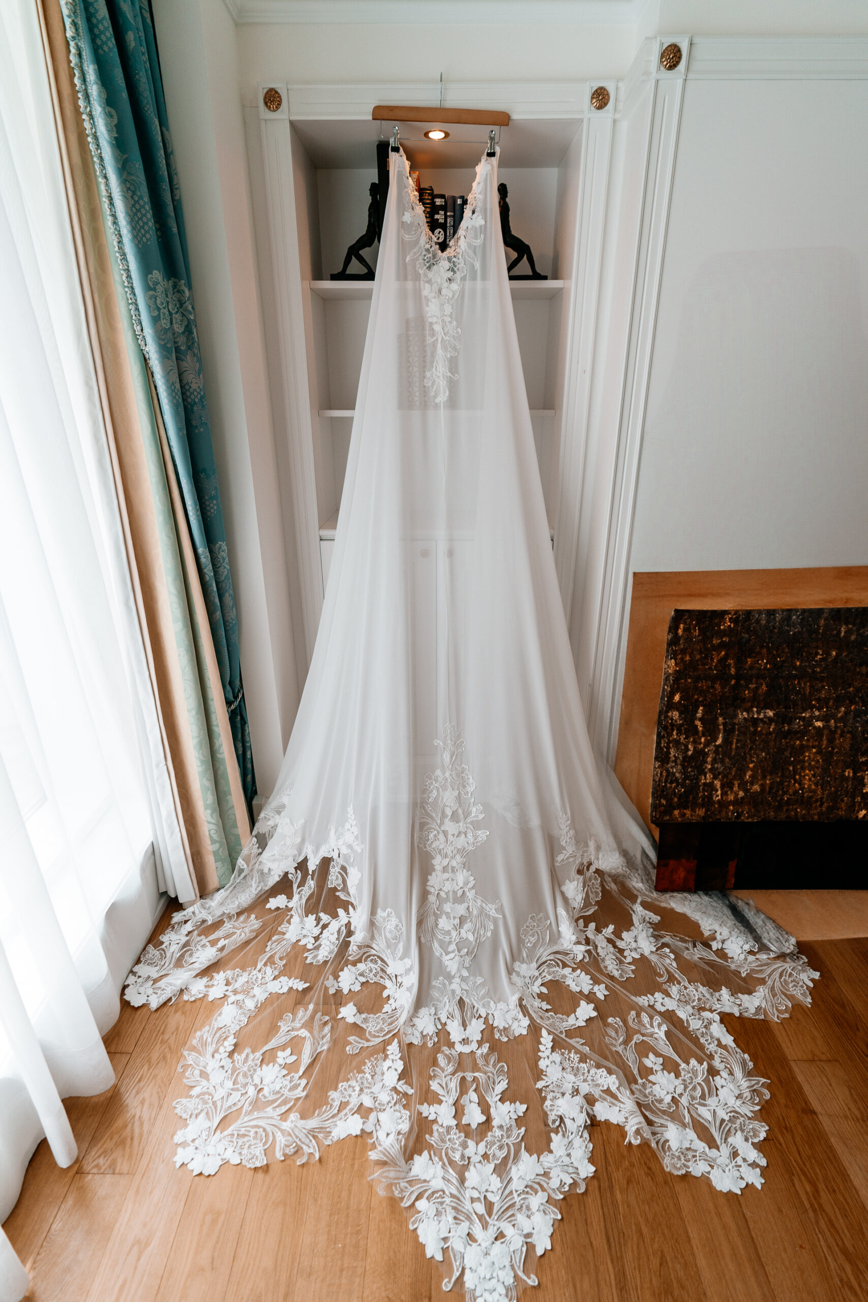 Bride getting ready at Powerscourt House, Wicklow, with her bridesmaids assisting in a luxurious suite.