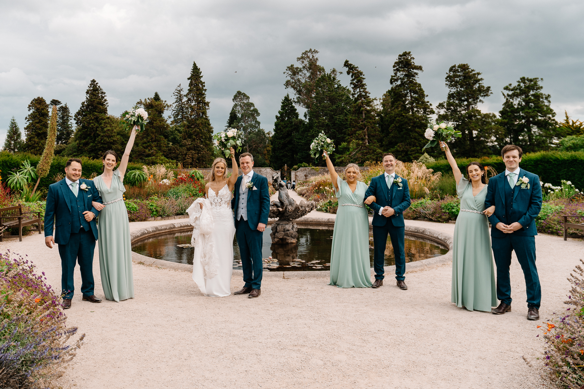 Bride celebrating with her bridesmaids at Powerscourt House in Wicklow.